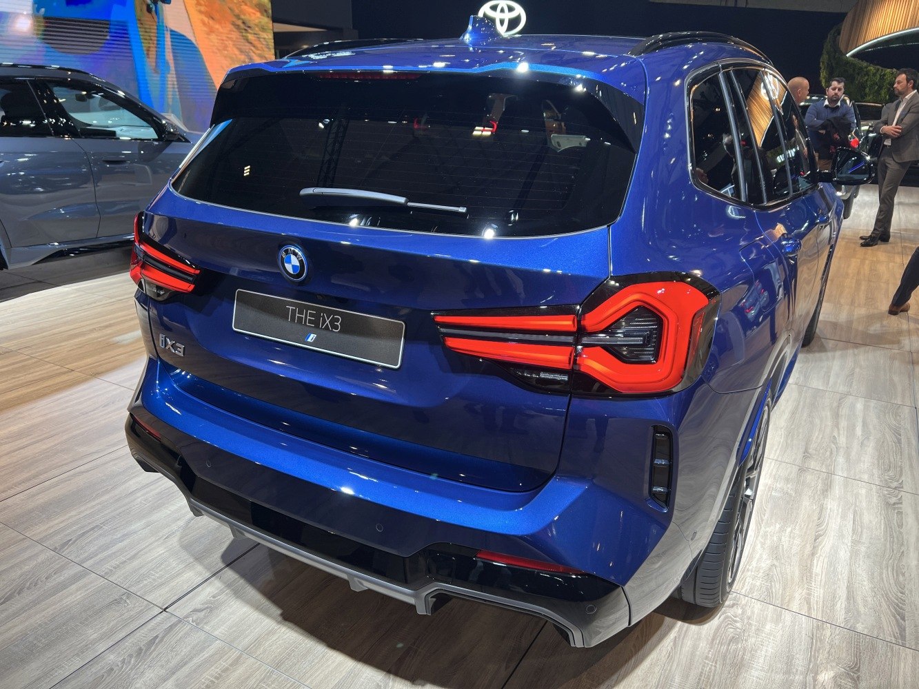Rear view of a blue SUV with distinctive LED taillights and modern design.