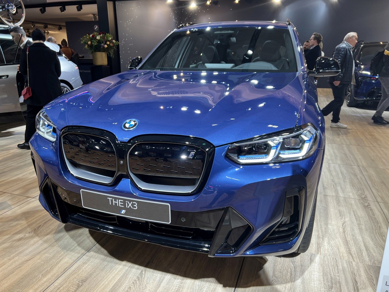 Electric SUV front grille and LED headlights close-up