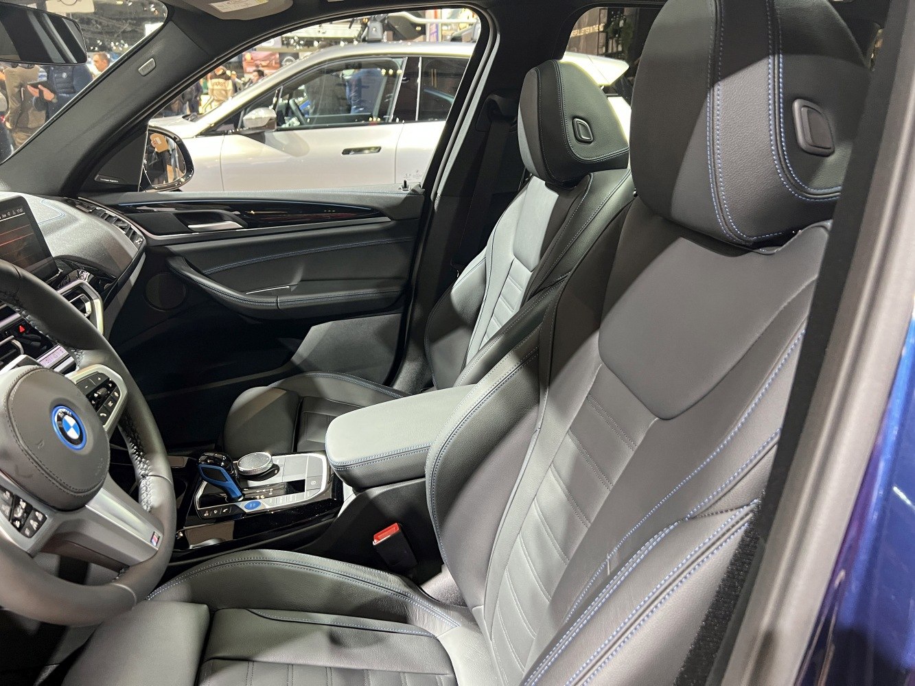 Luxury leather interior with modern dashboard and blue contrast stitching