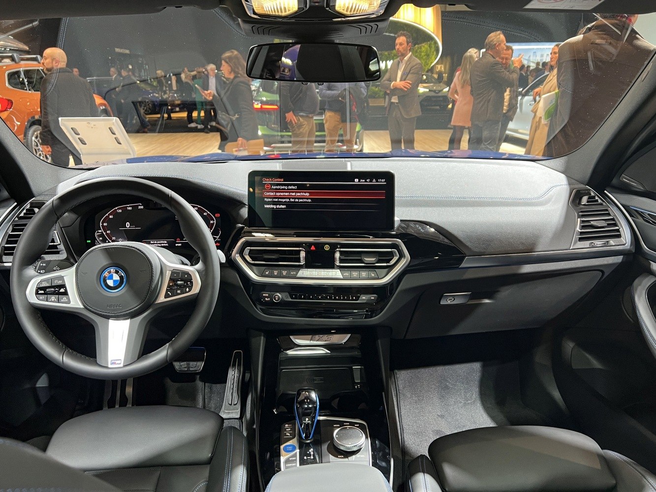 Modern BMW iX3 dashboard and steering wheel with digital displays