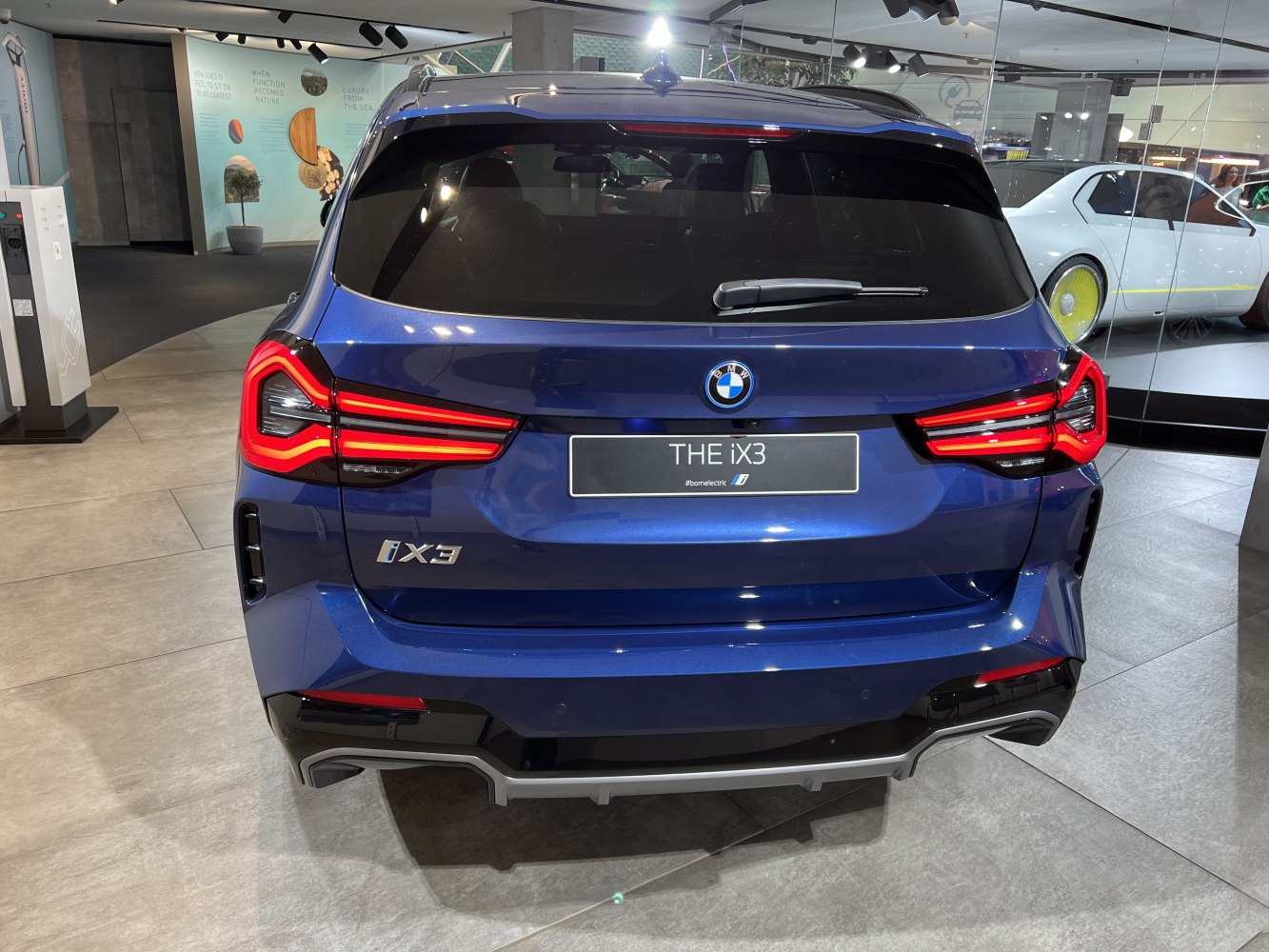 Rear view showing LED tail lights and rear hatch design of an electric SUV