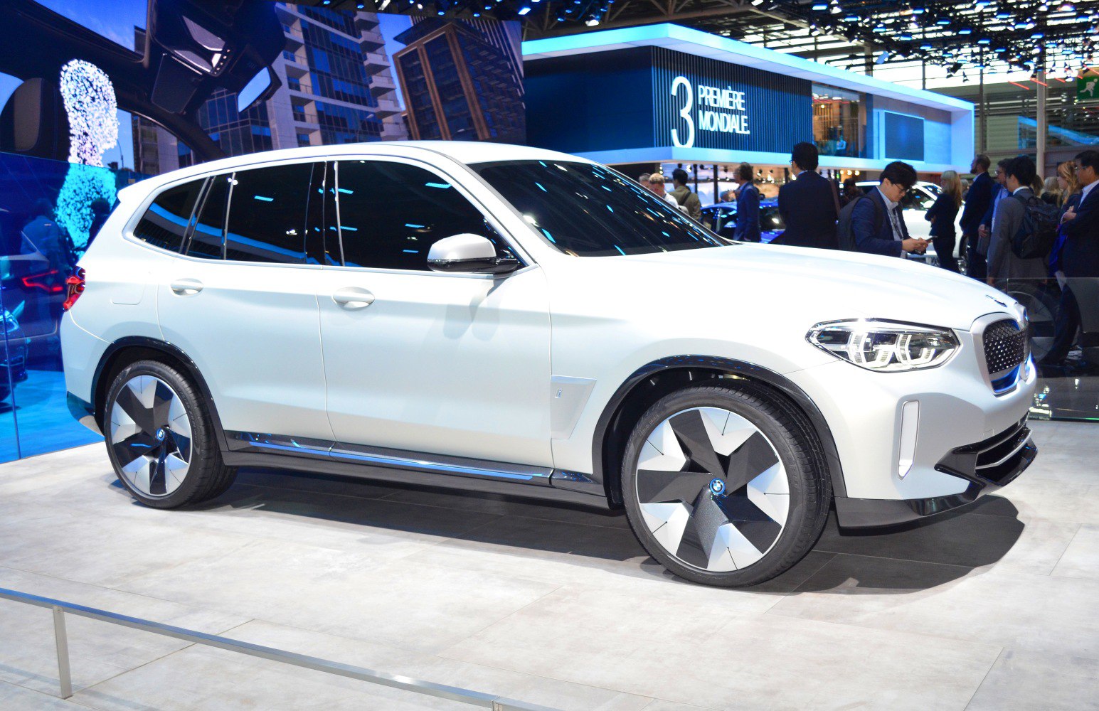 White electric SUV with futuristic aerodynamic wheels