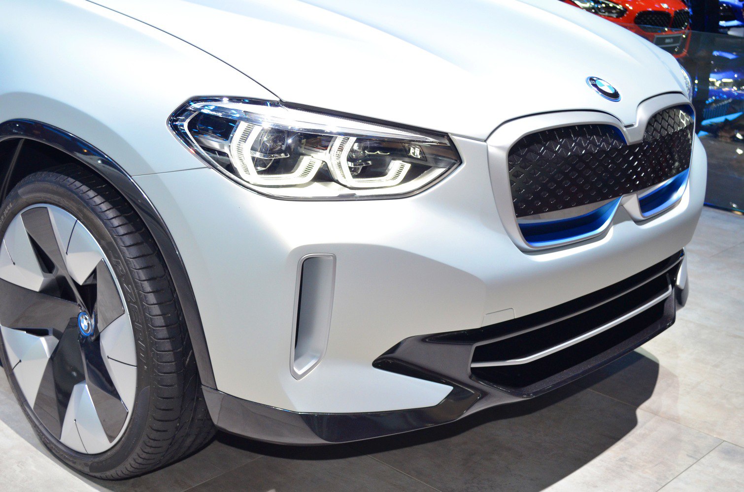 Front close-up with LED headlights and aerodynamic wheel design