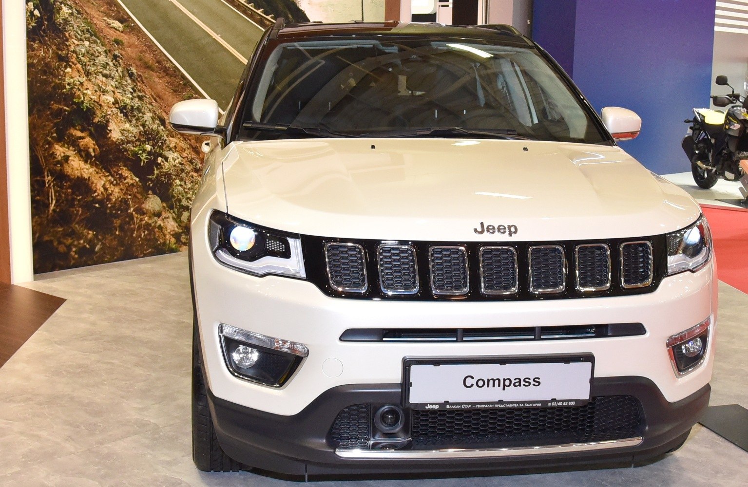 Front view with LED headlights and seven-slot grille
