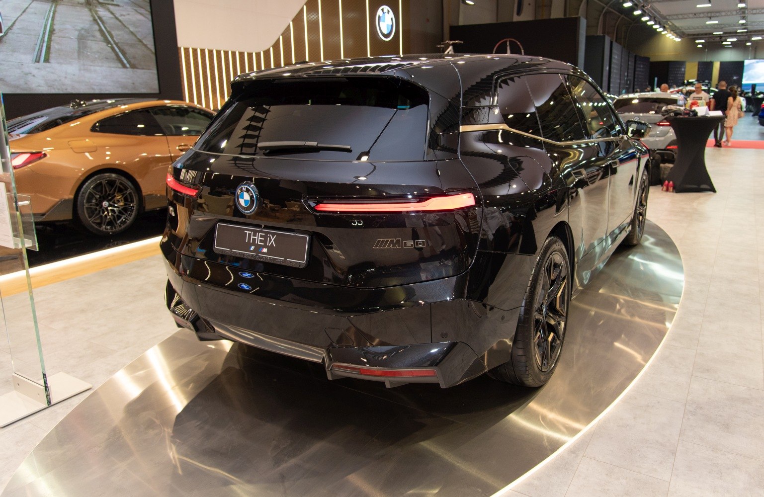 High-gloss black SUV rear with sleek taillights and bold design elements
