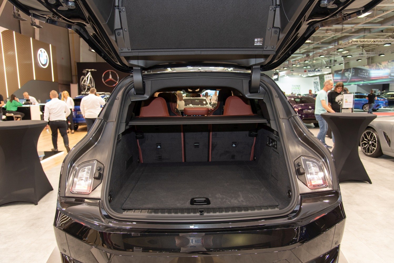 Spacious rear cargo trunk interior with modern design and seating visible