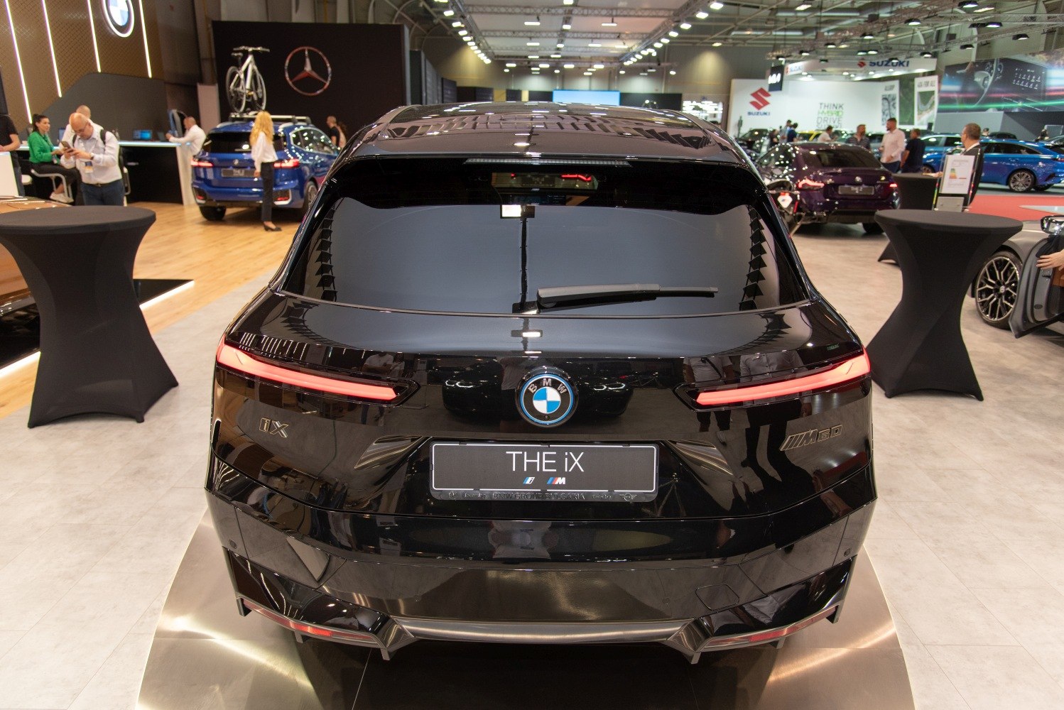 Rear view of electric SUV with modern LED taillights and M60 badge
