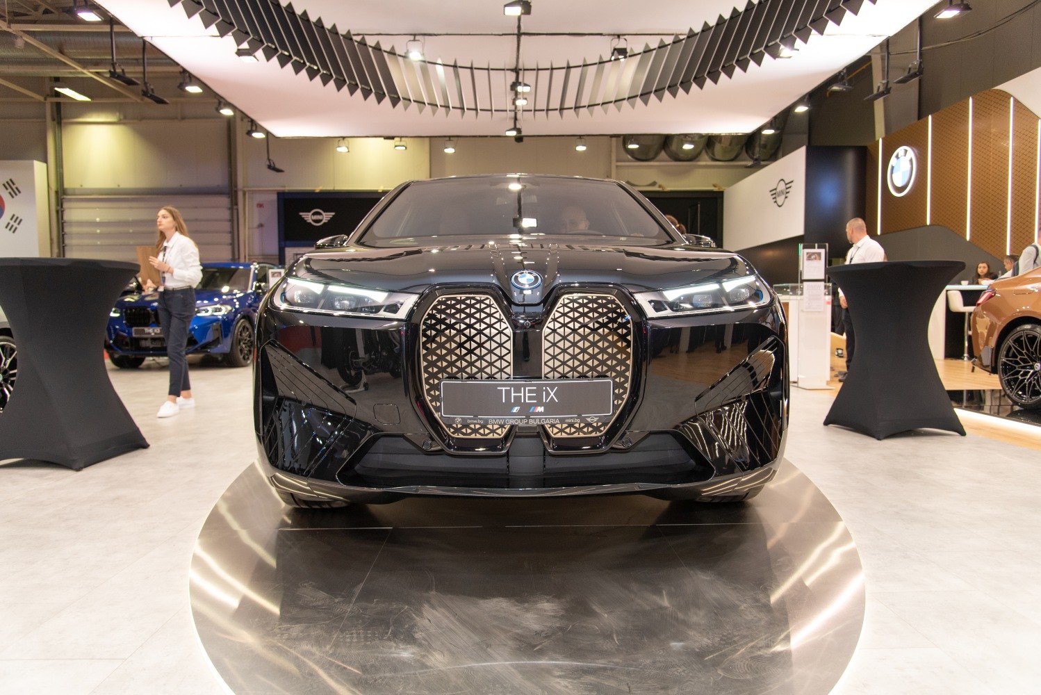 Front view of vehicle with large patterned grille and LED headlights