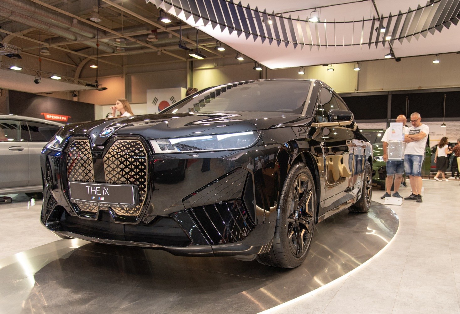 Electric SUV with large front grille and sleek headlights