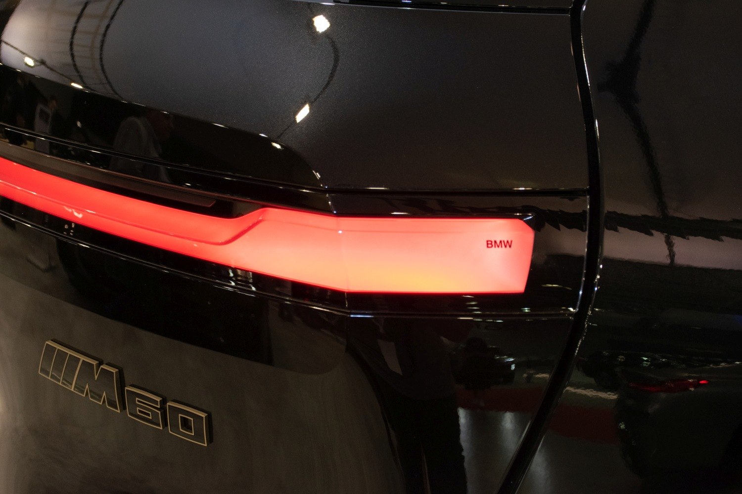 Rear LED taillight and M60 badge on black surface