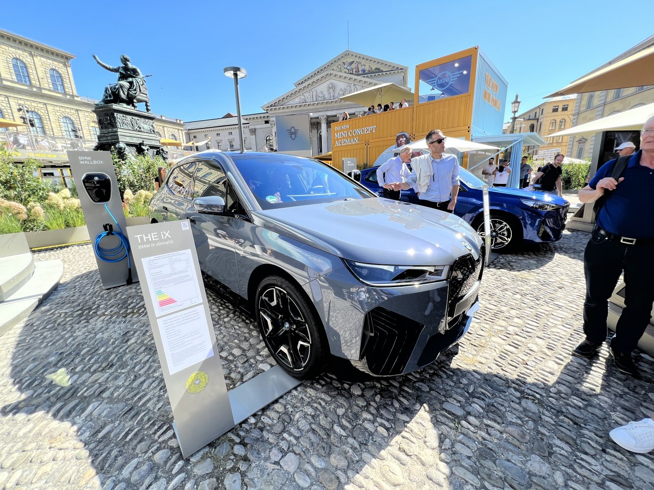 High-angle front view of an electric SUV at a charging station