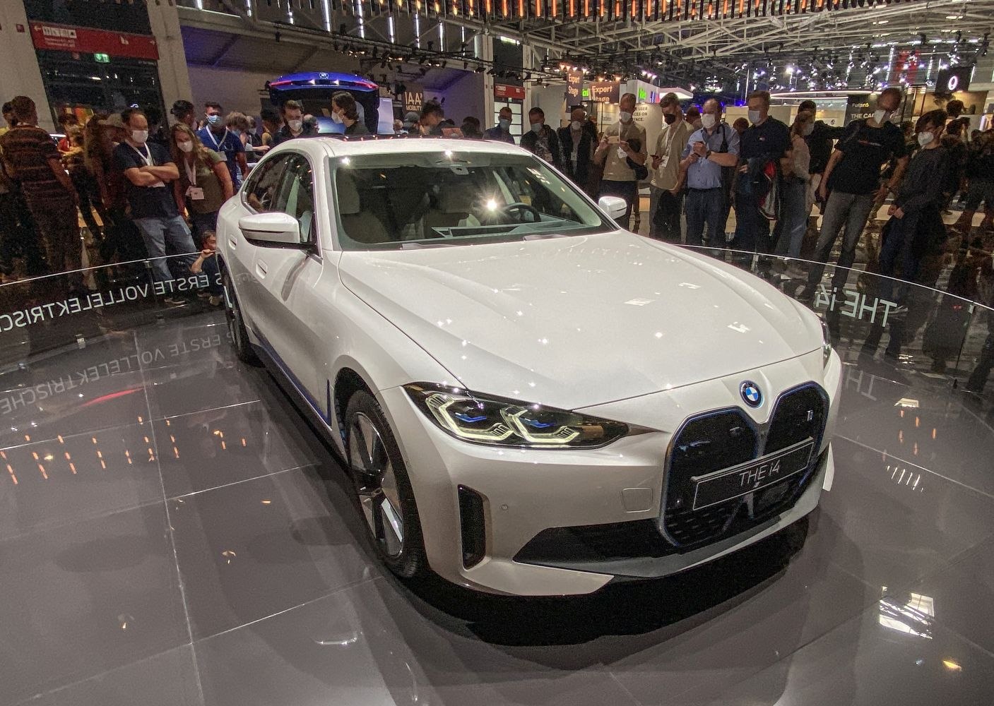 Front view of electric sedan with LED headlights and kidney grille