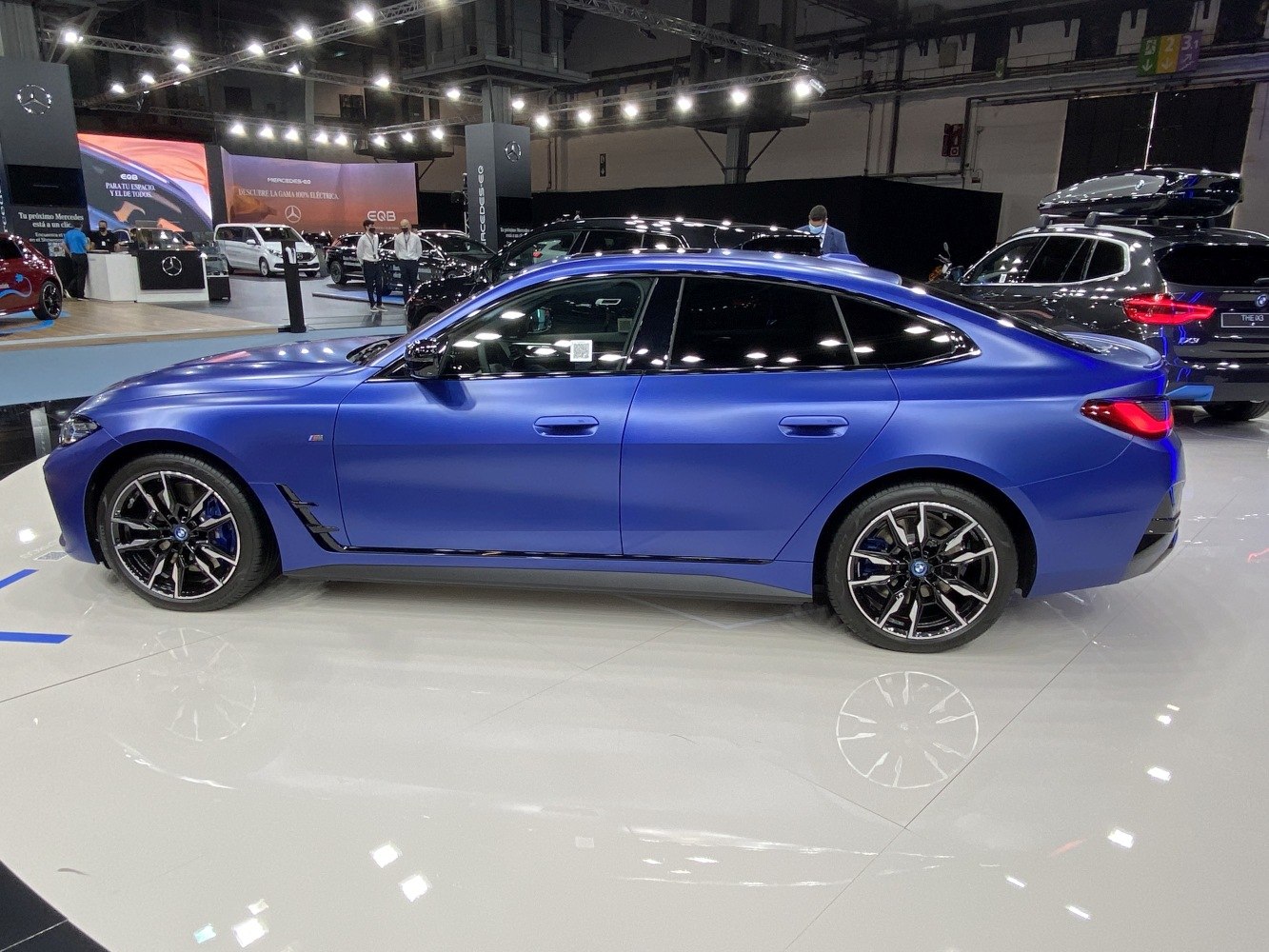 Side profile of electric sedan with sporty wheels and aerodynamic design