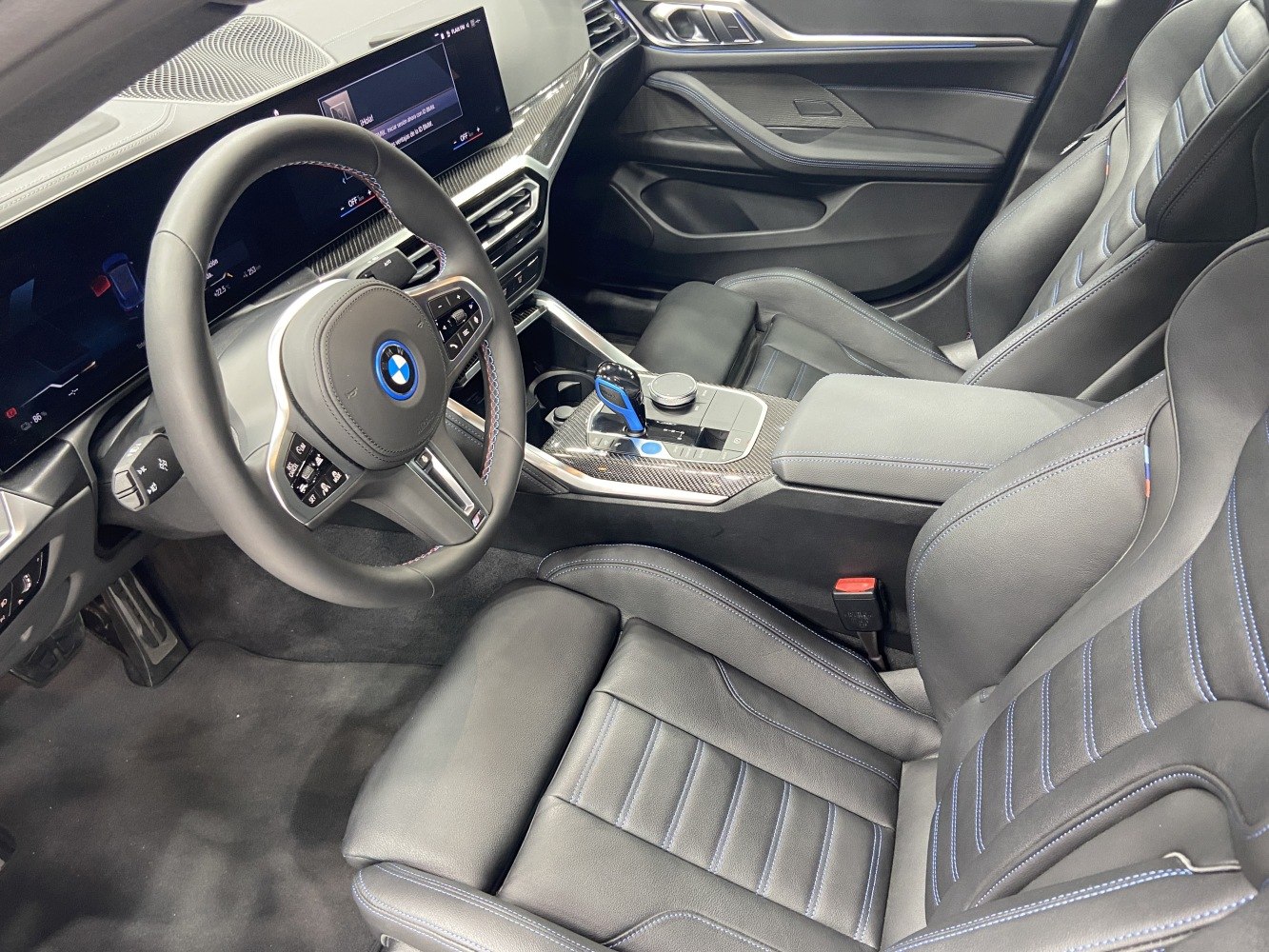 BMW i4 digital dashboard and sporty ergonomic seats