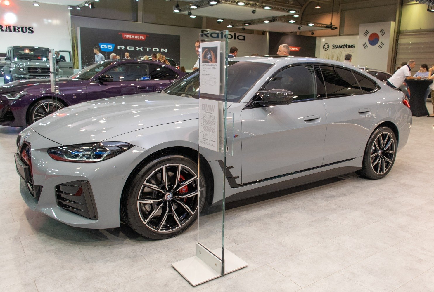Front side view showcasing sharp headlights and distinctive alloy wheels.
