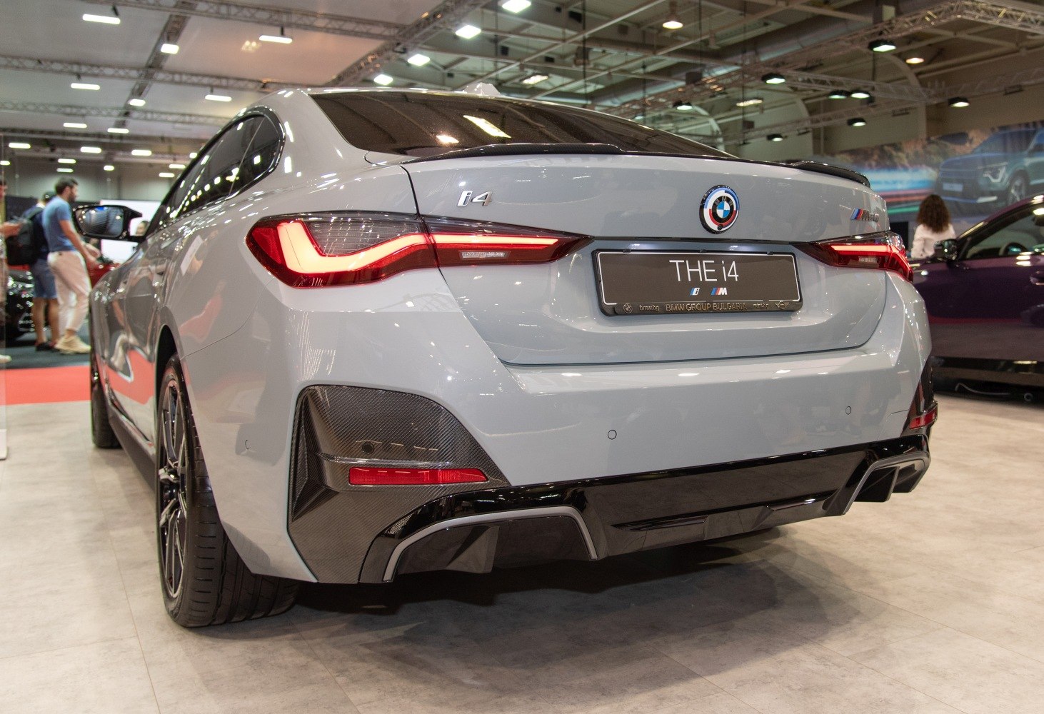 Rear view showcasing tail lights and sporty diffuser