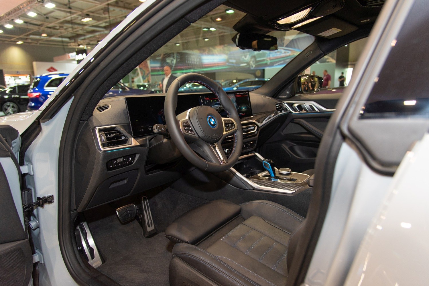 Steering wheel and dual digital dashboard display inside modern car interior