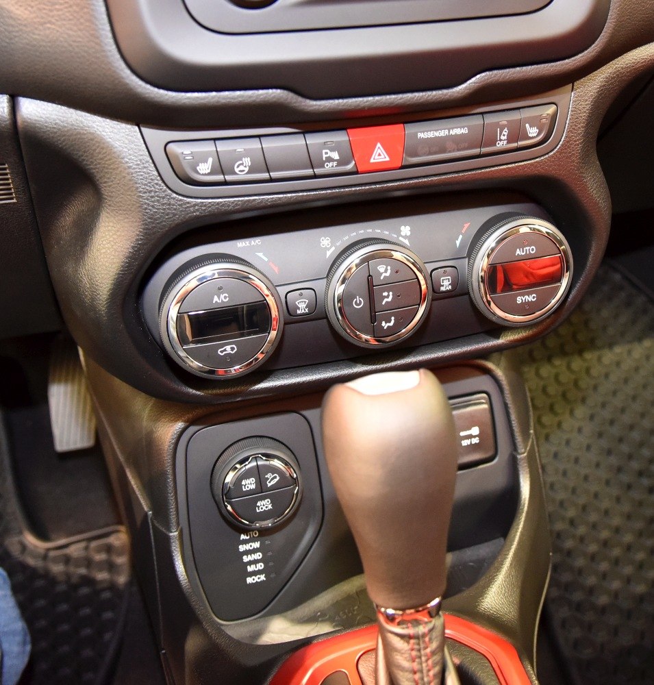 Climate control knobs and terrain drive mode selector with gear lever