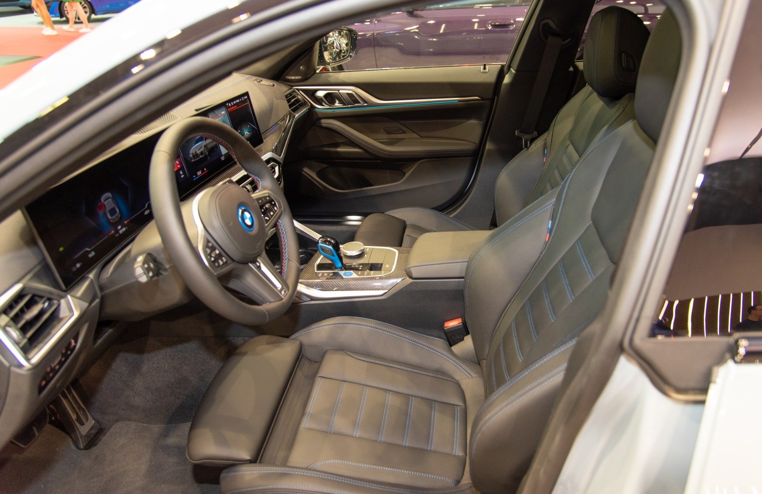 Modern BMW car interior with digital dashboard and leather seats