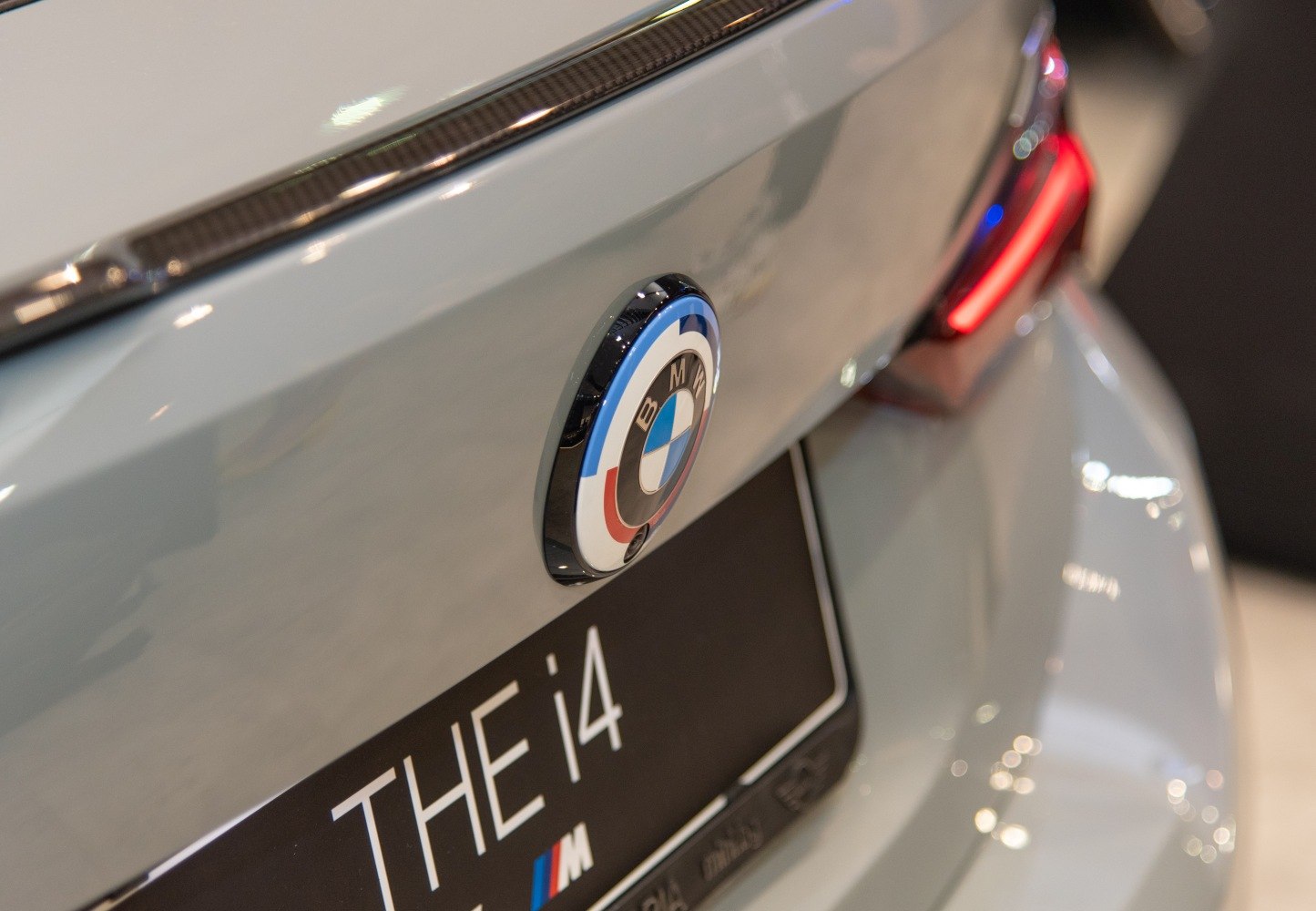 Close-up on BMW badge and tail light at rear end