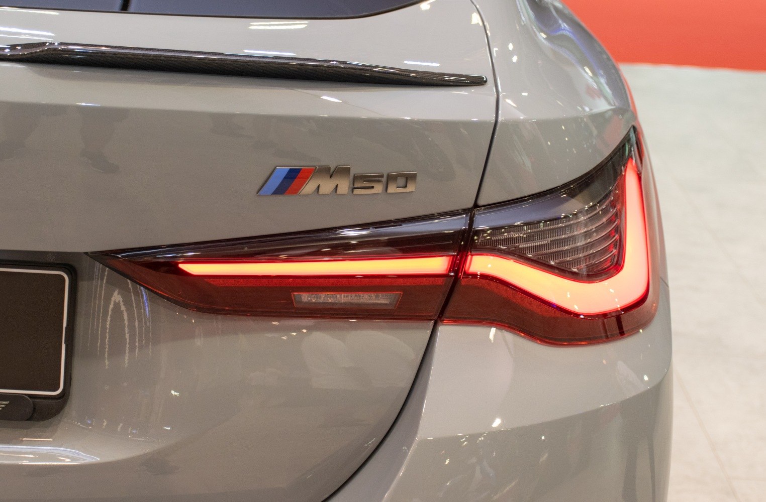 Rear tail light and M50 badge with illuminated lighting elements