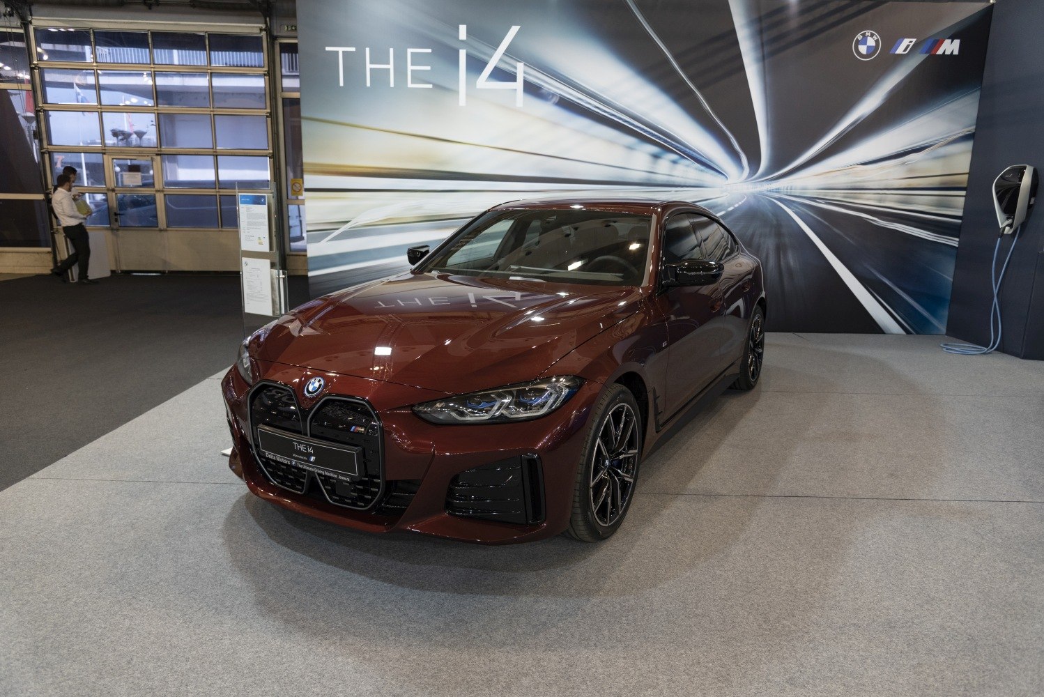 Front view of electric sedan with prominent kidney grille and sleek headlights
