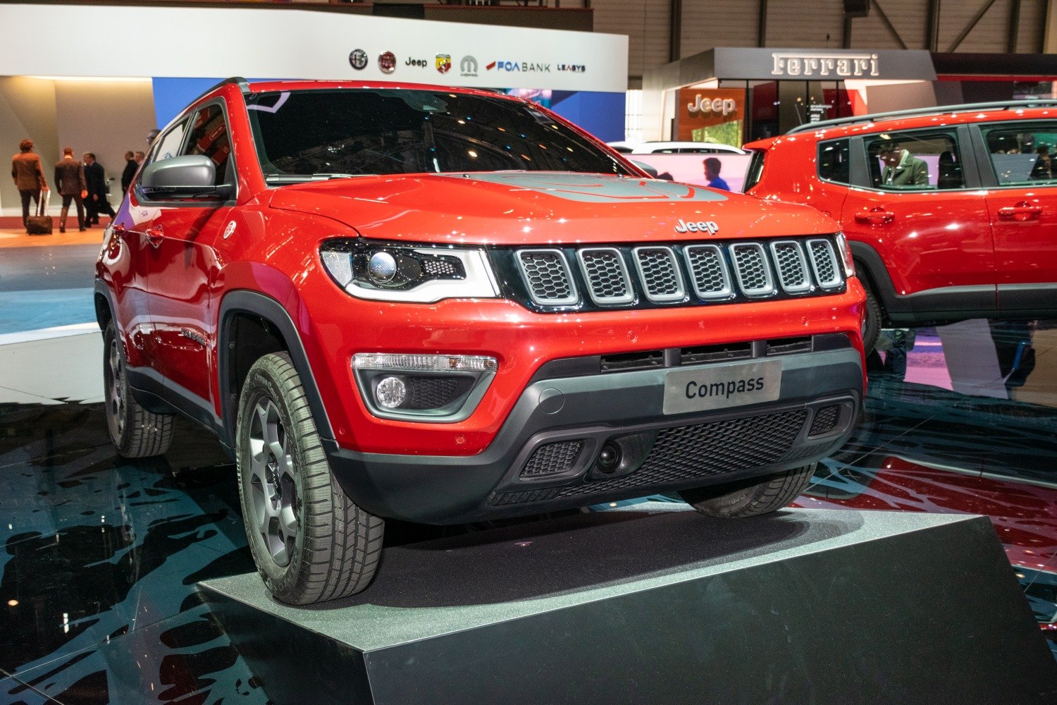 Front view of red compact SUV with distinctive grille and headlights