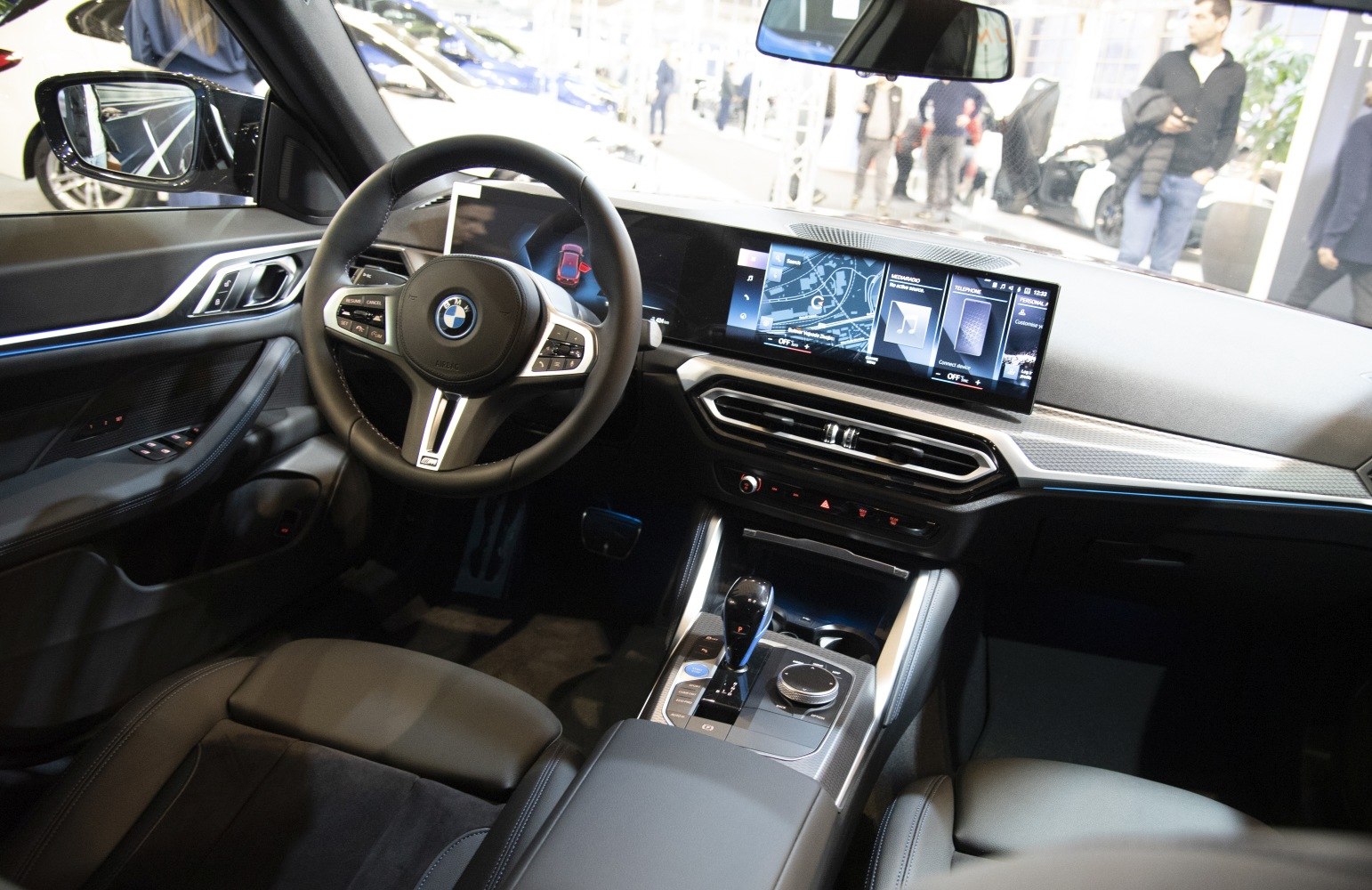 Modern vehicle interior with digital dashboard and multi-function steering wheel