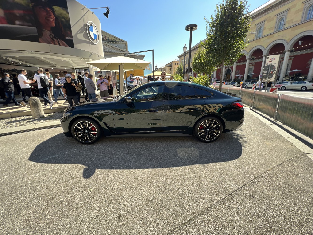 Side profile showing aerodynamic body and sporty alloy wheels with red brake calipers.