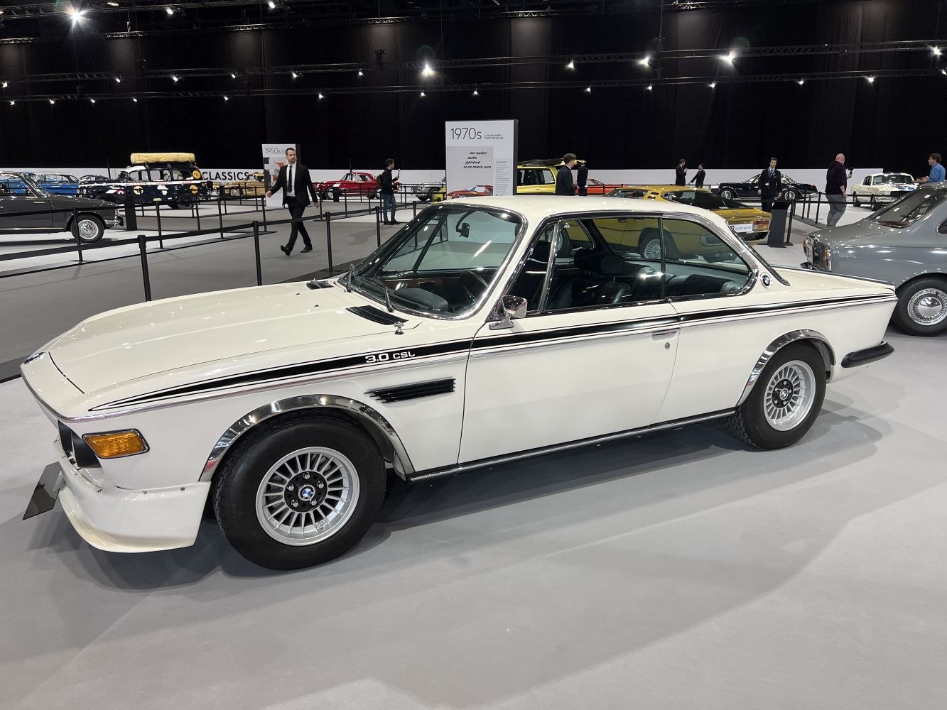 Side profile of classic sporty coupe with distinctive fender flares and alloy wheels