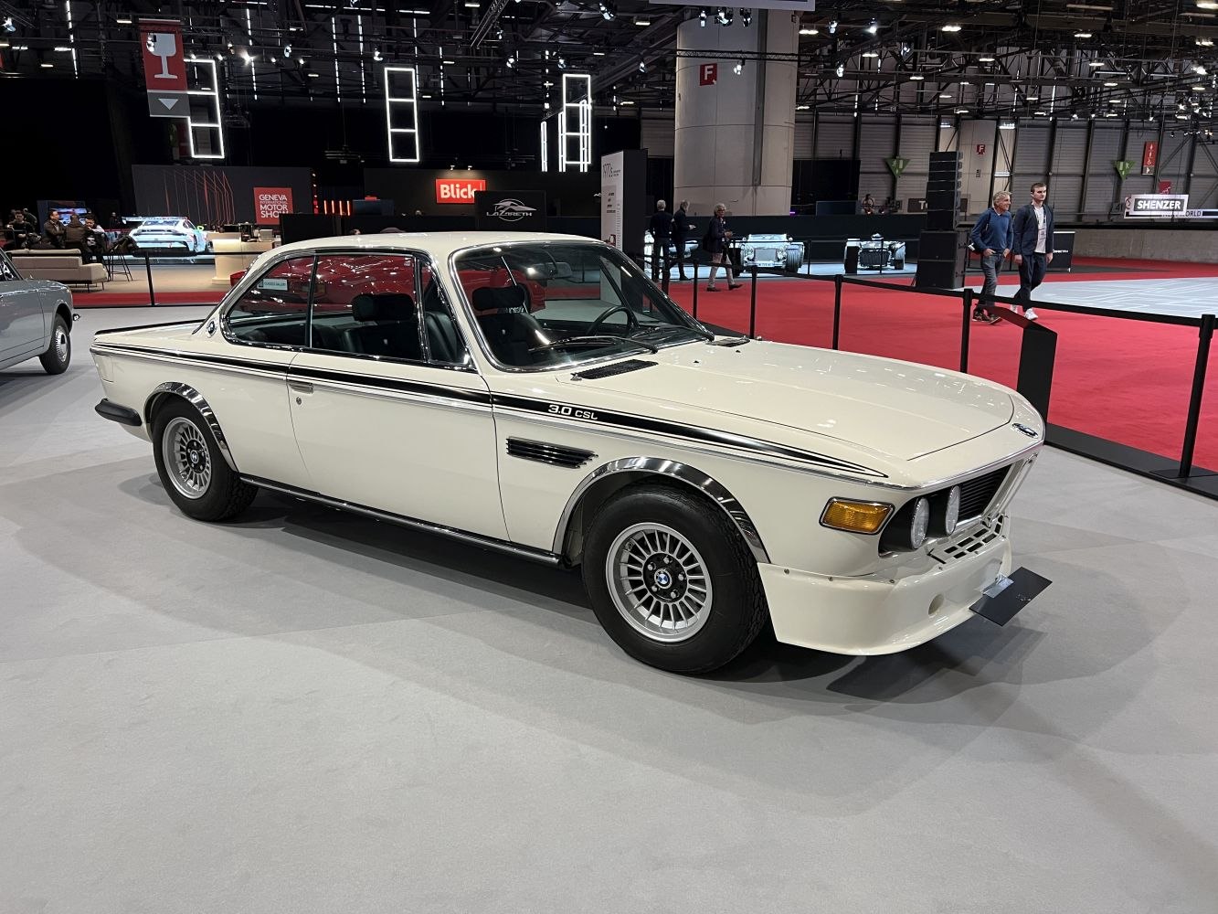 Vintage coupe with chrome wheel arches and four round headlights