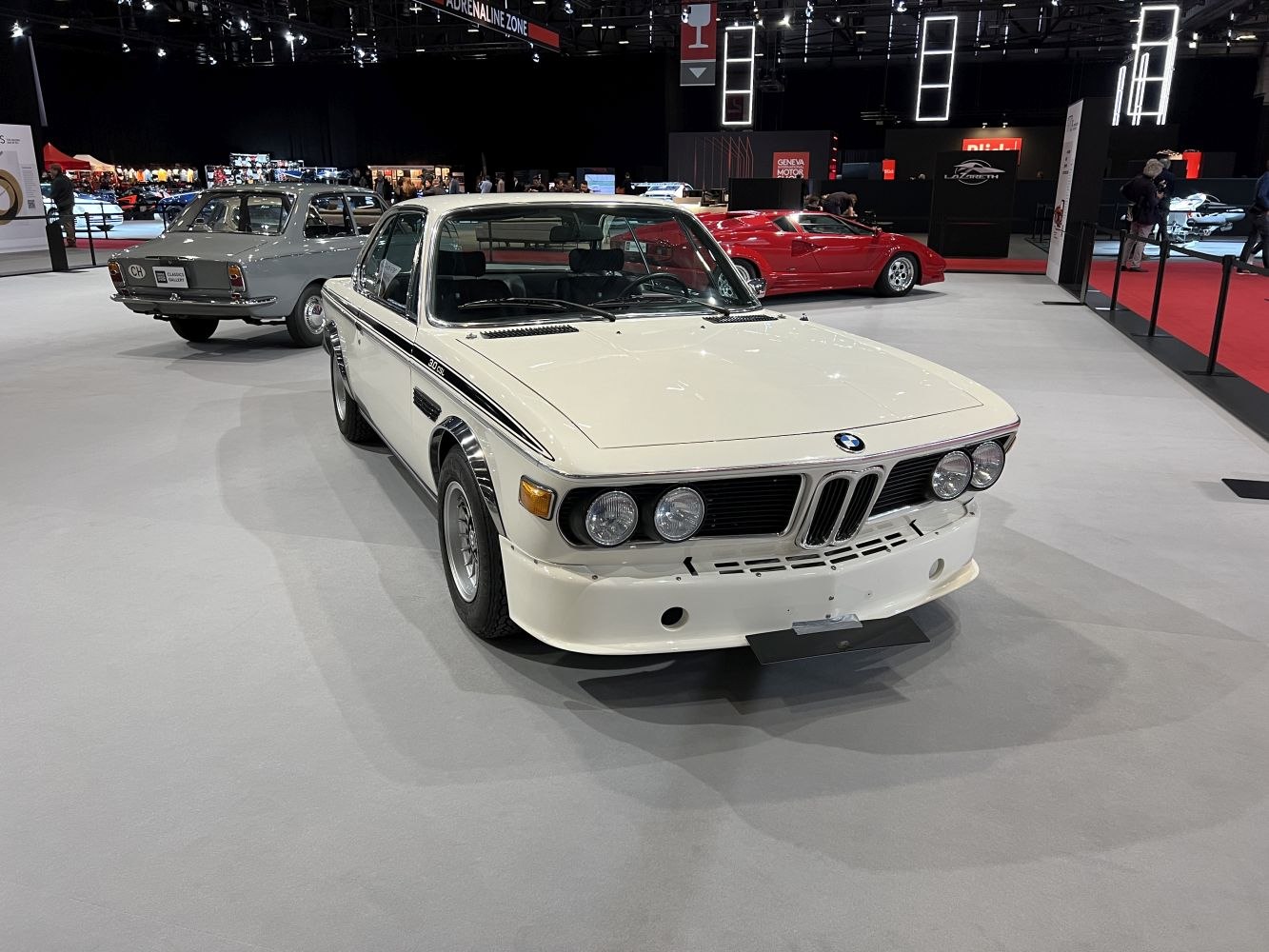 Front perspective with quad round headlights and sporty bumper design
