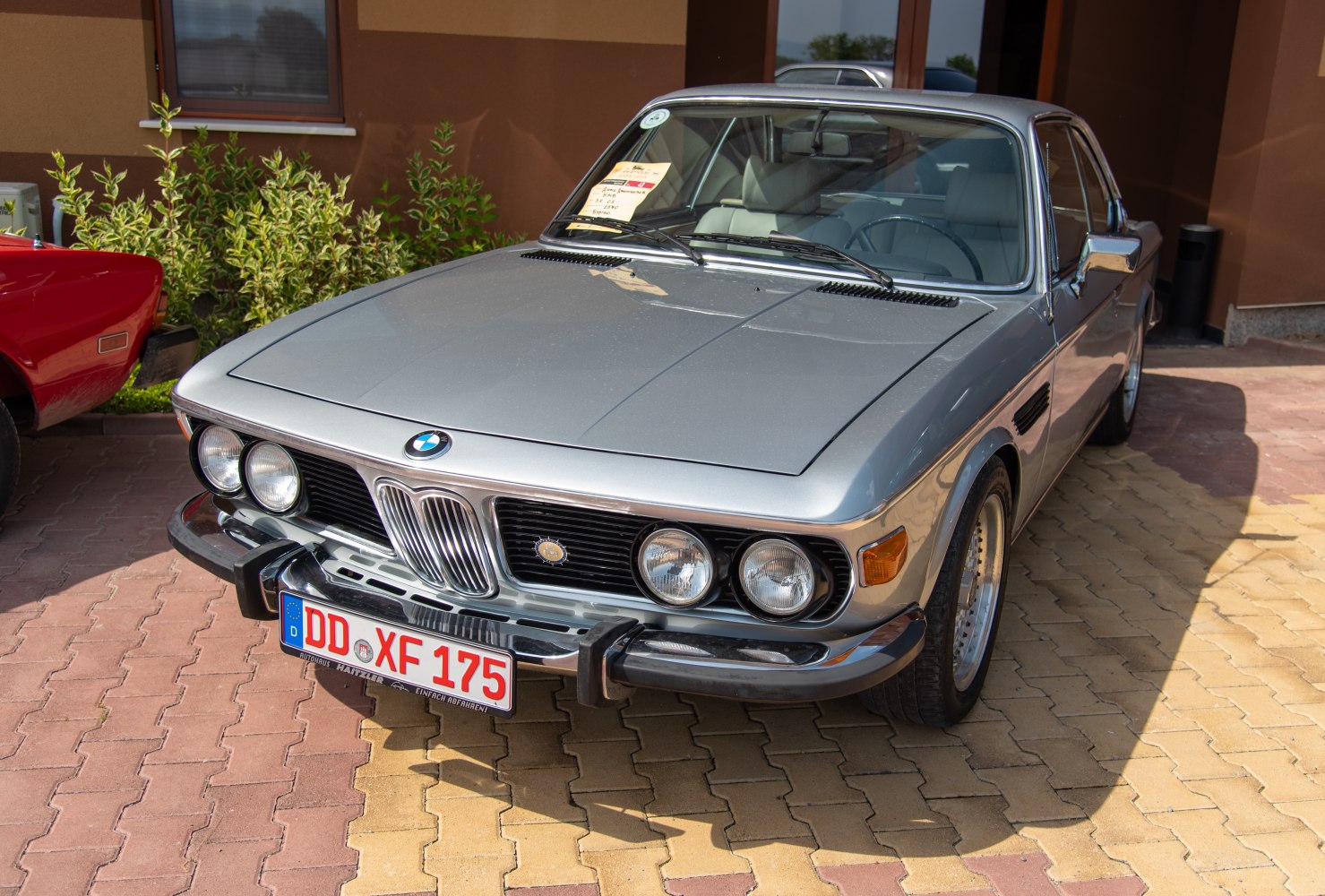 Front grille and quad round headlights of vintage coupe