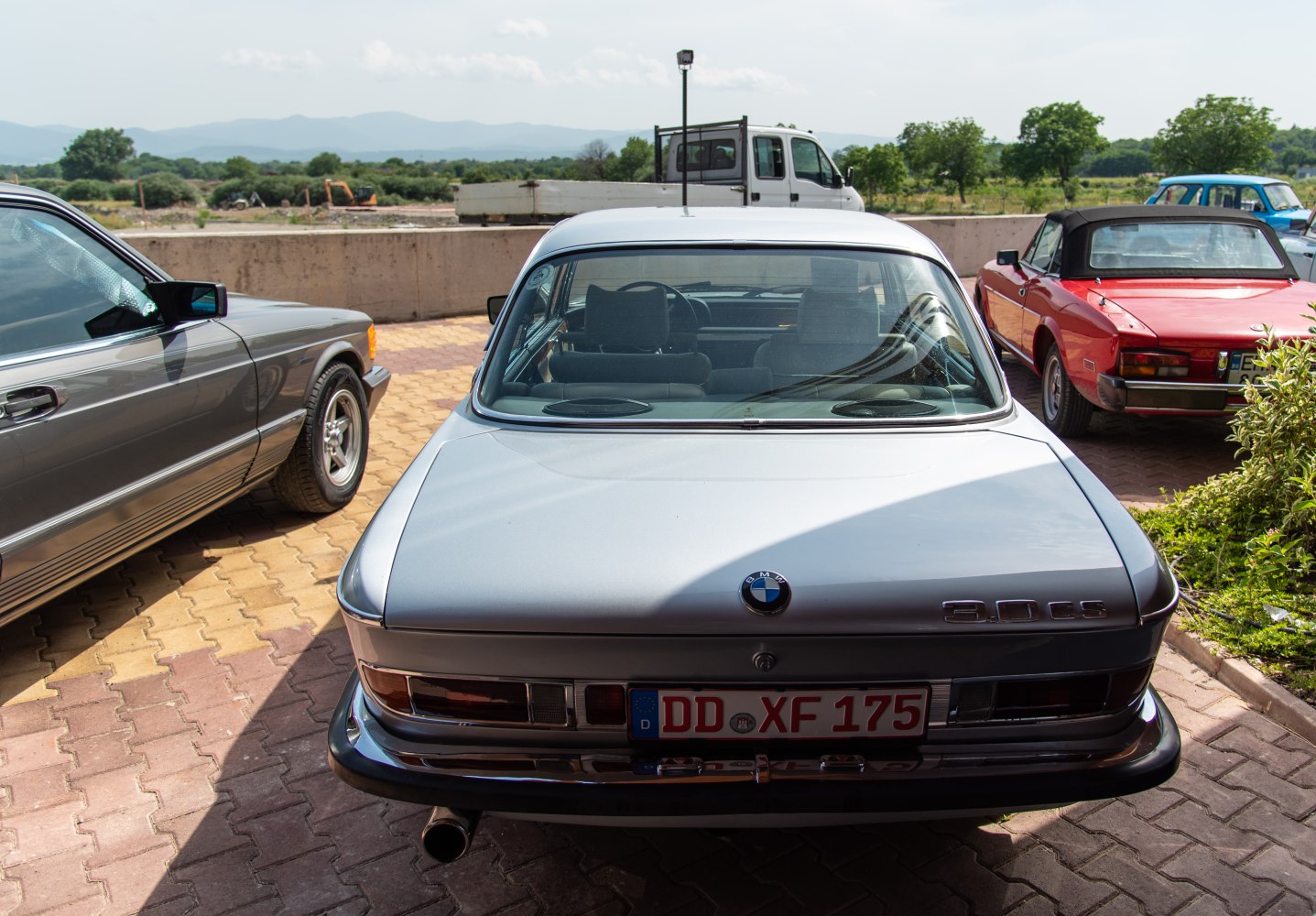 Rear view of a classic coupe with vintage taillights and distinctive trunk design