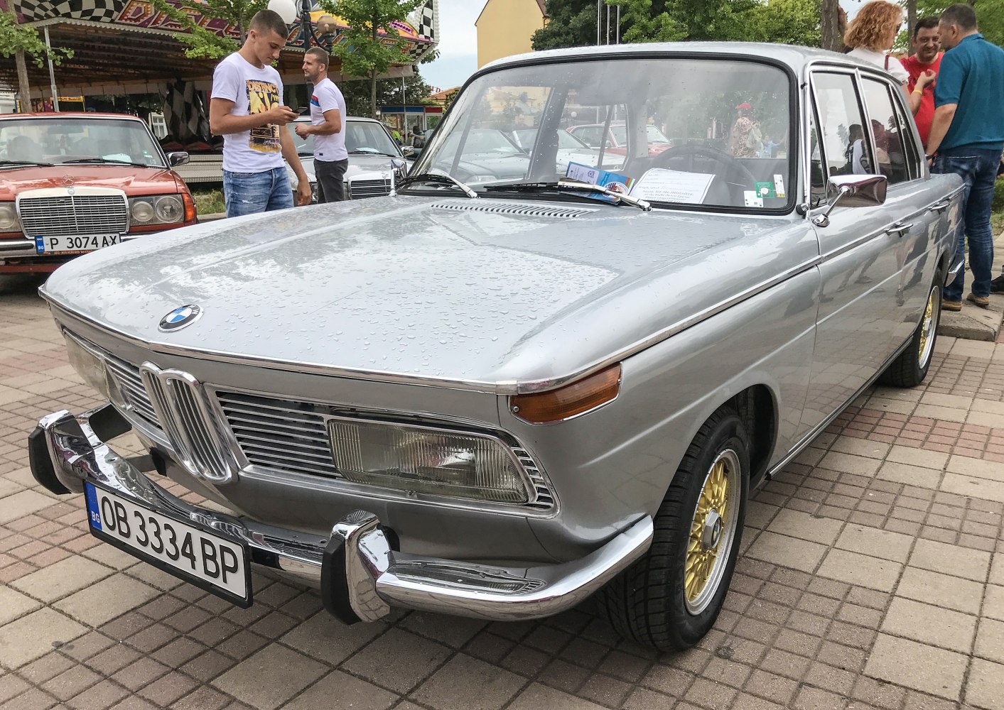 Vintage BMW front grille and headlights with stylish chrome bumper and gold wheels