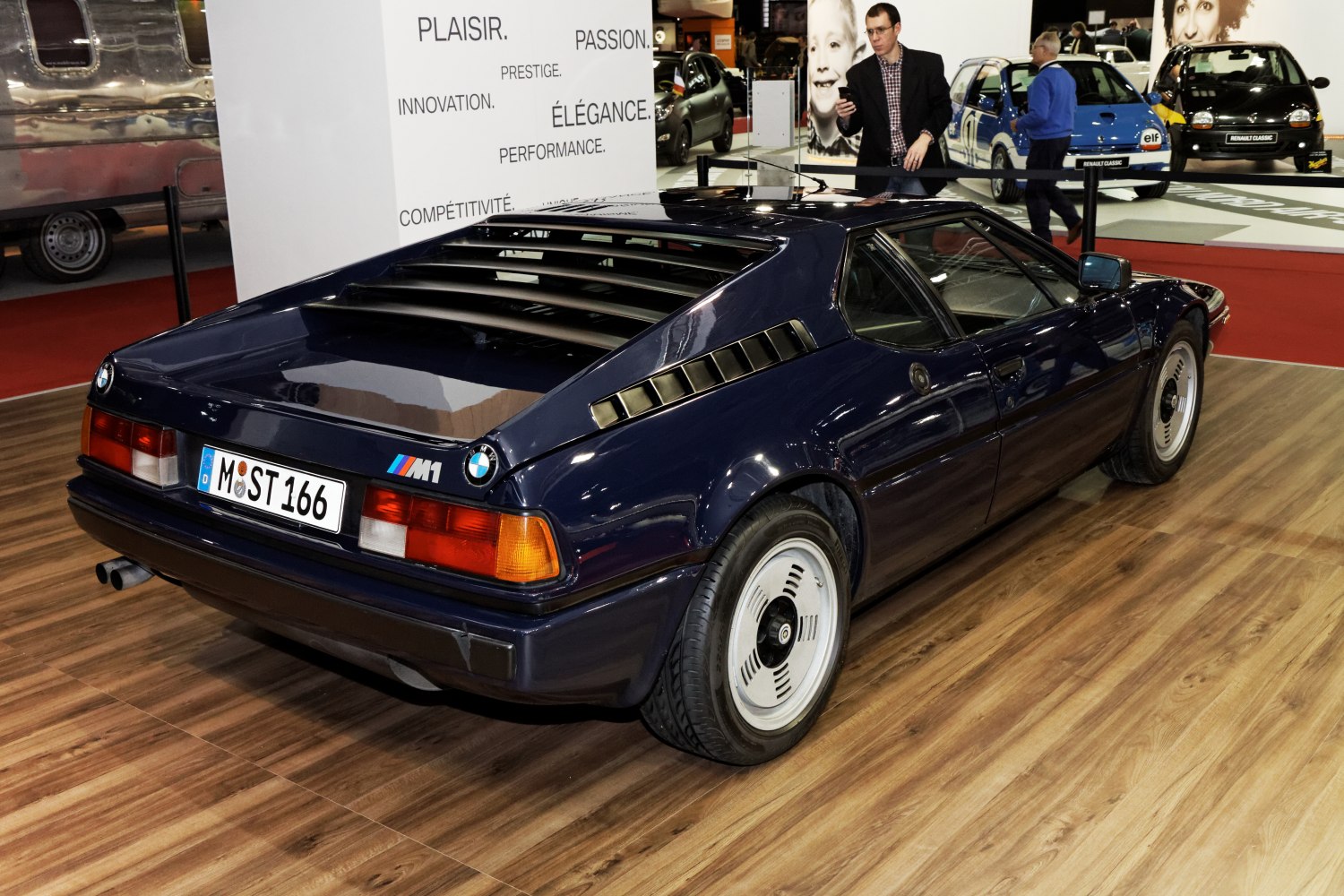 Rear-side view with louvered rear window and classic wheels