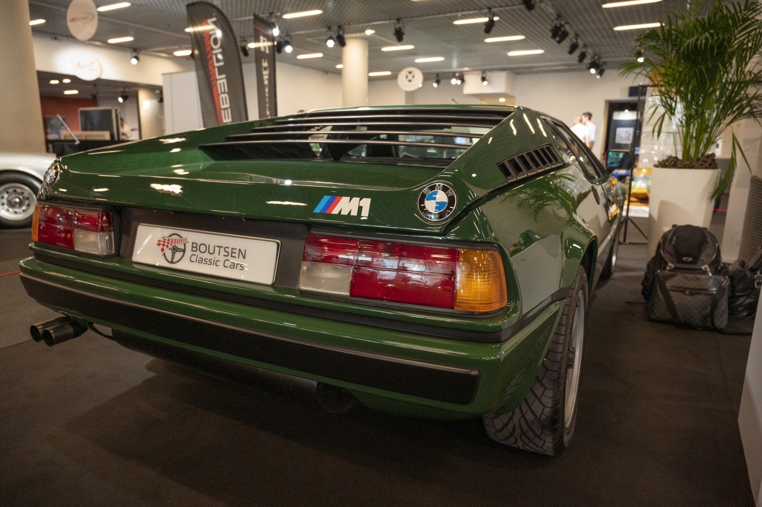 Rear view of classic sports car with tail lights and rear grille