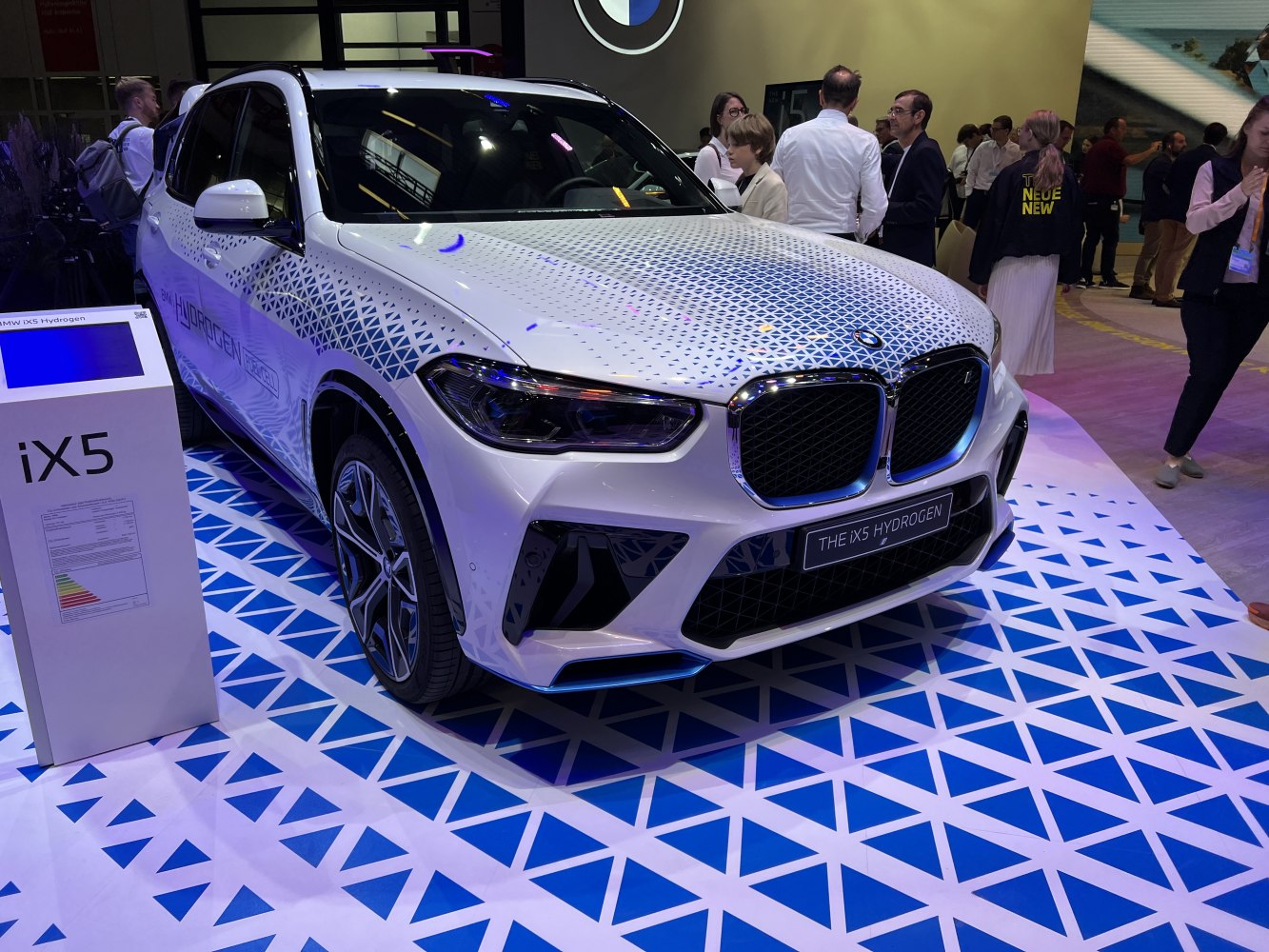 Front view of 2022 hydrogen-powered SUV with blue geometric pattern and LED headlights.