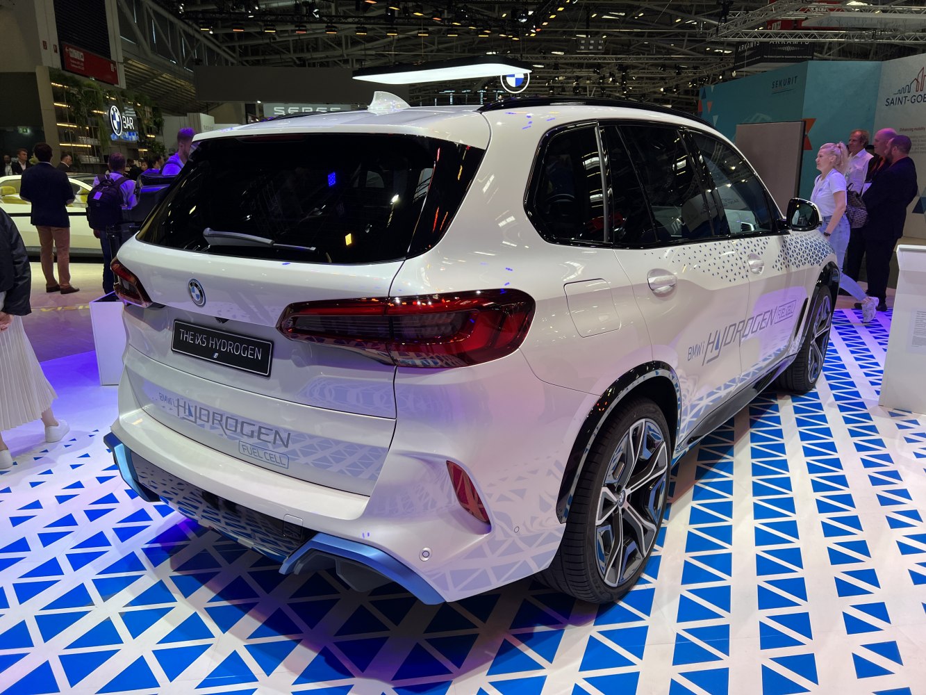 Rear and side view of hydrogen fuel cell SUV with branding and-modern design.