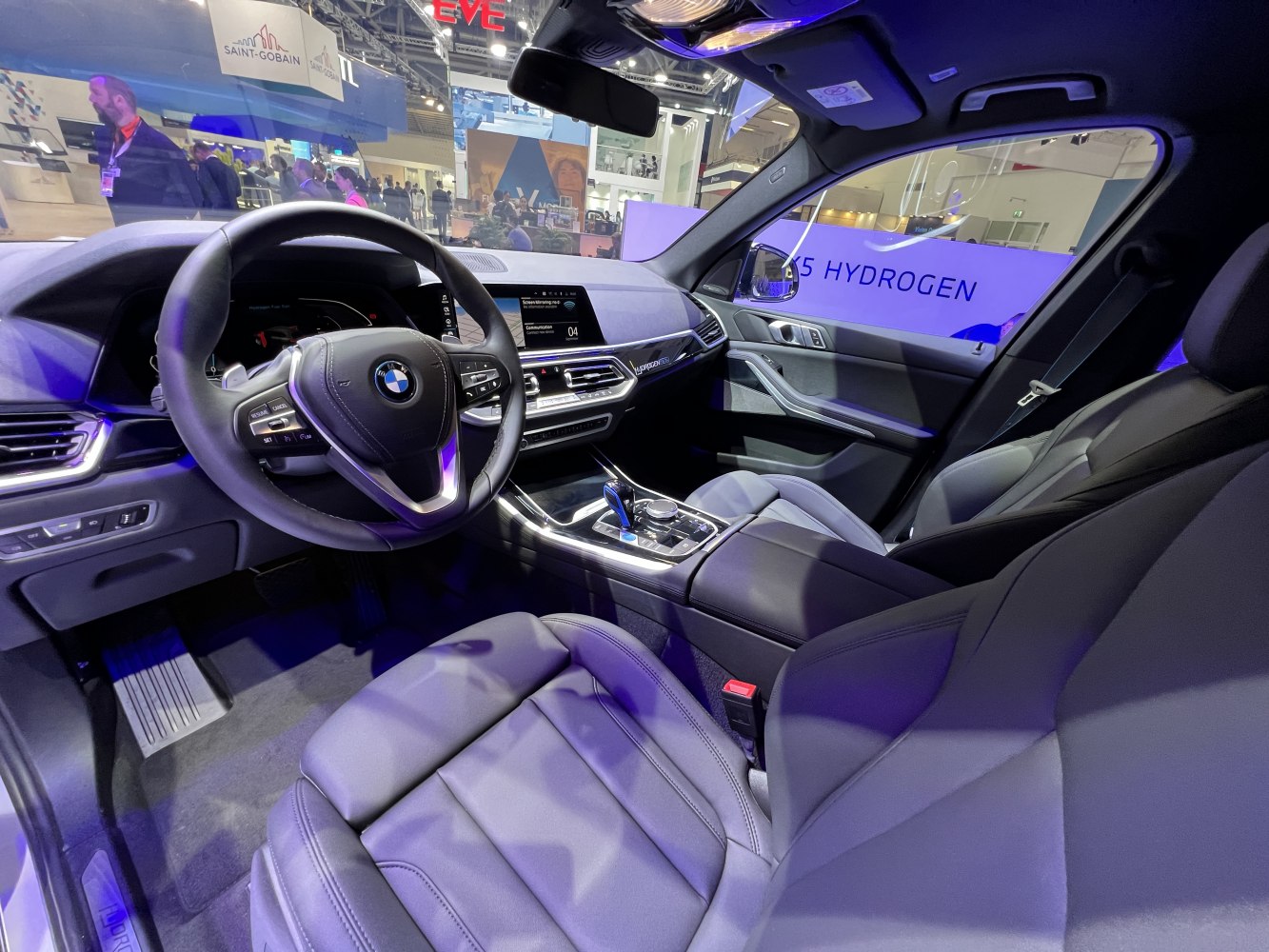 Modern digital dashboard and premium front leather seats in car interior
