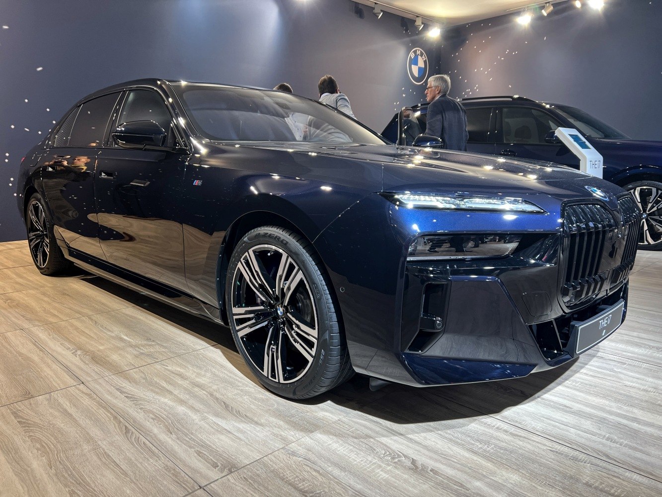 Wide angle front and wheel design of luxury sedan with LED headlights and kidney grille