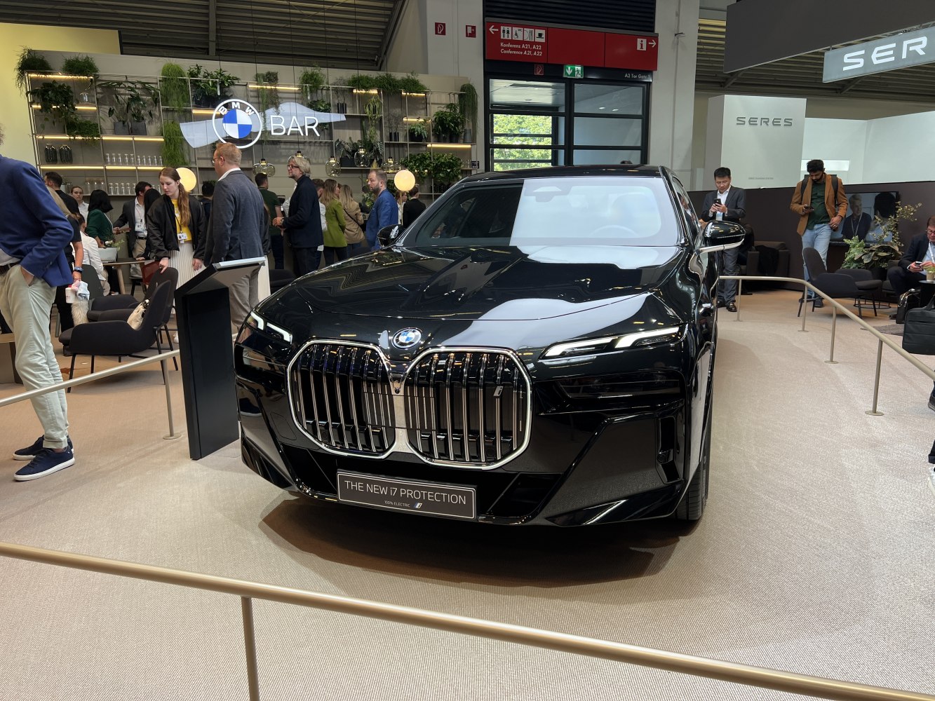 Large kidney grille and LED headlights on luxury electric sedan front