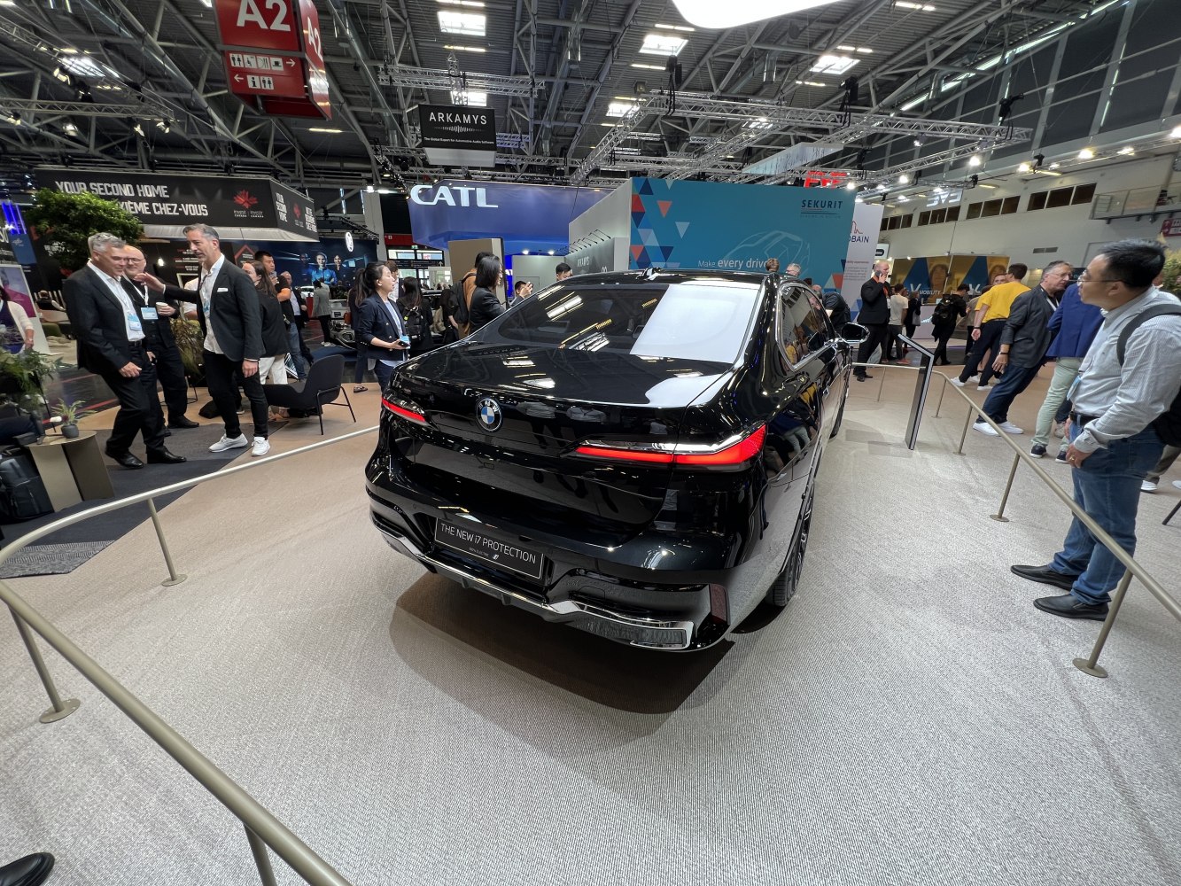 Rear view of a sleek black luxury electric sedan with distinctive LED taillights