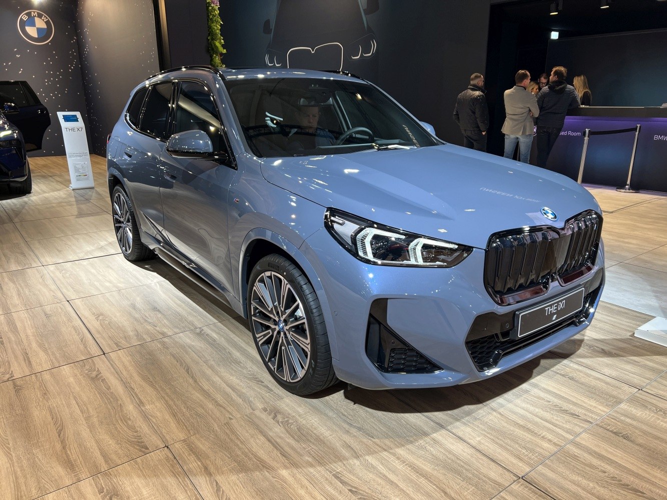Front three-quarter view showing LED headlights and kidney grille
