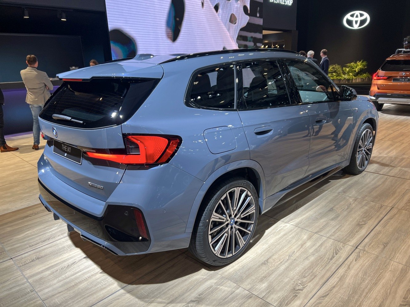 Rear and side view featuring taillights and alloy wheels