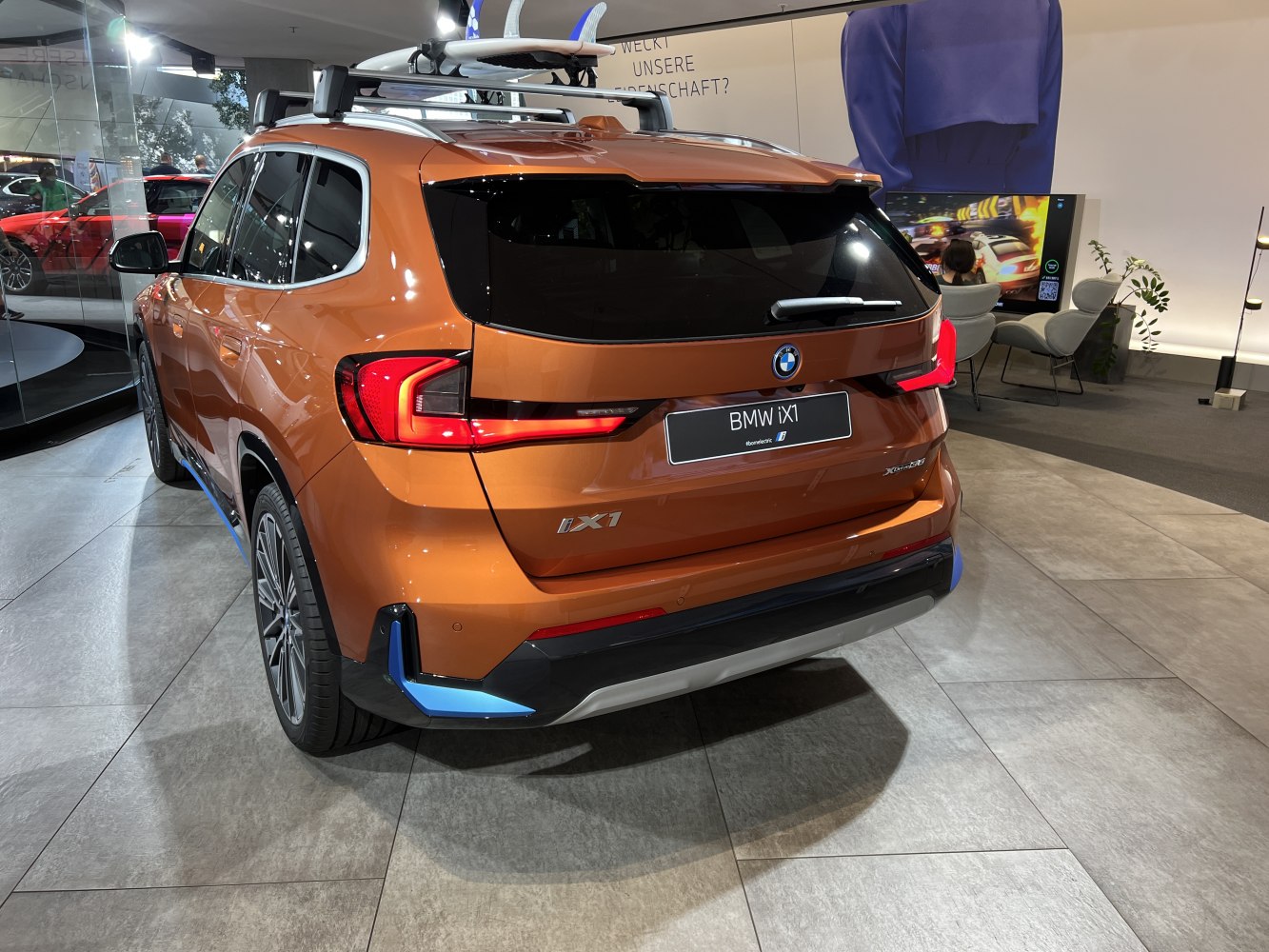 Rear view with distinct tail lights and roof rack on SUV