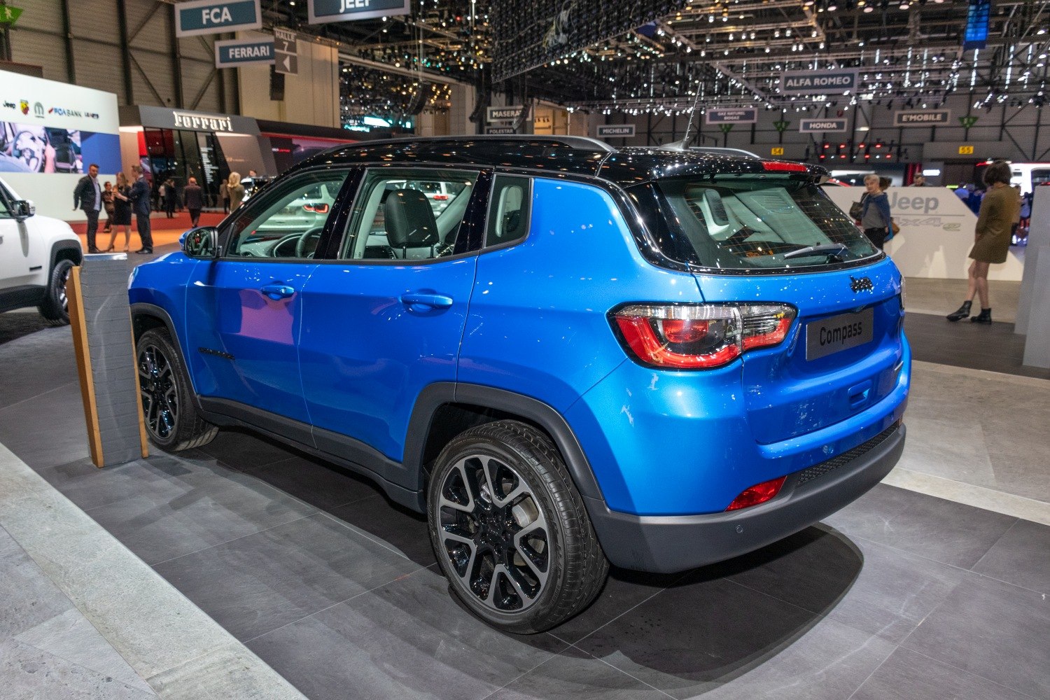 Blue compact SUV rear and side view with black roof and alloy wheels
