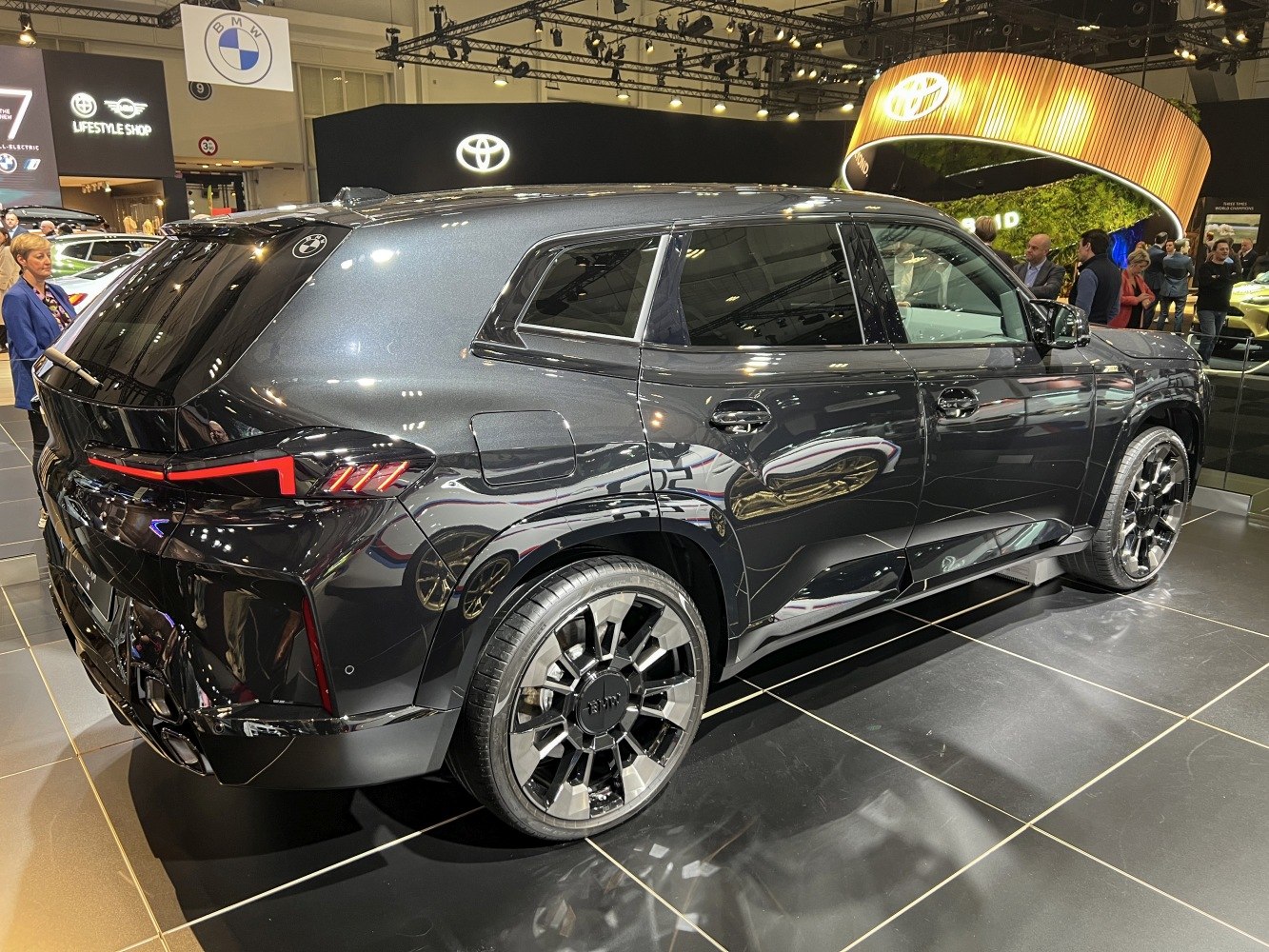 Rear and side view of modern SUV with alloy wheels and sleek taillights
