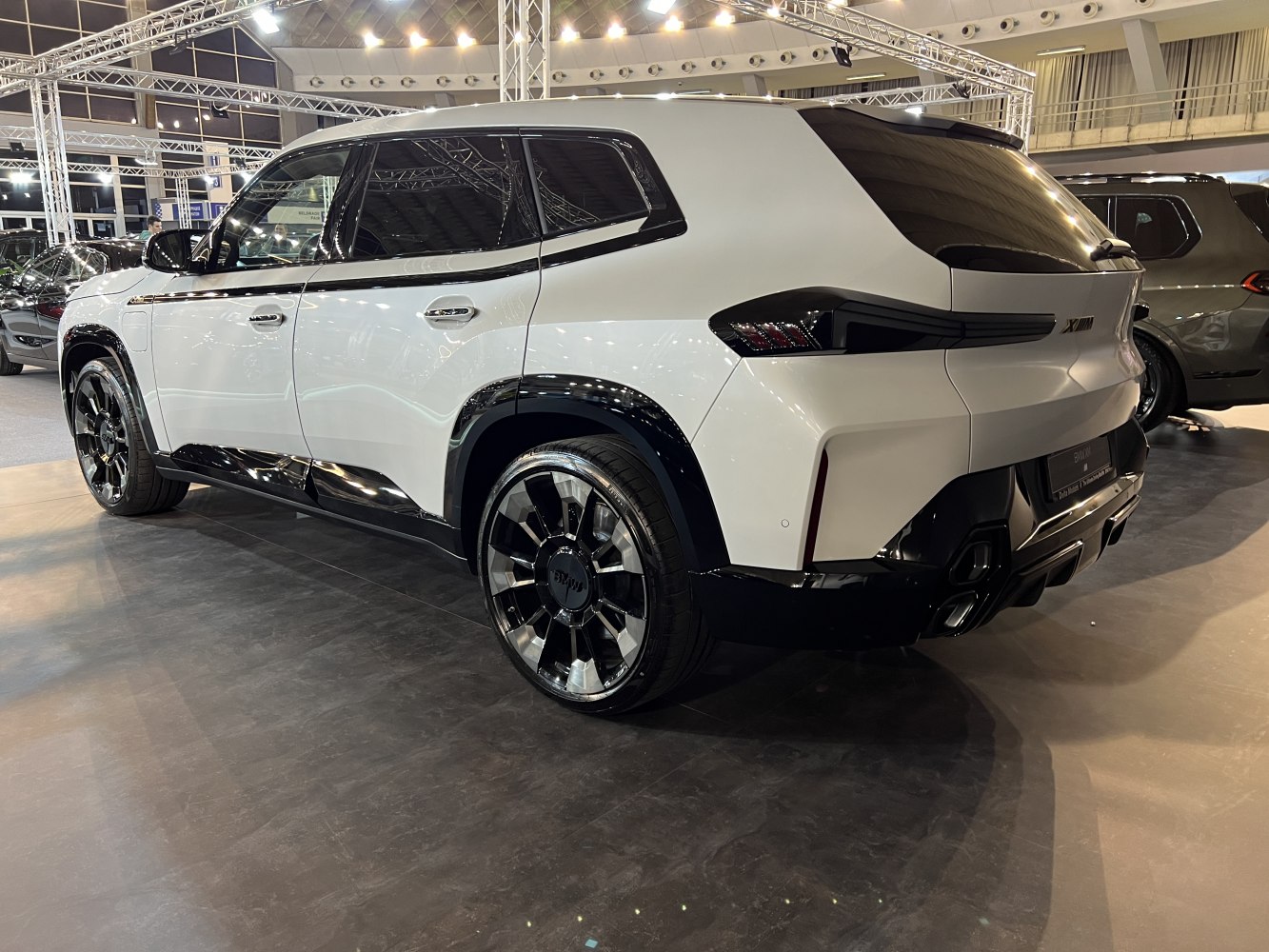 Rear side view with distinctive tail lights and black alloy wheels