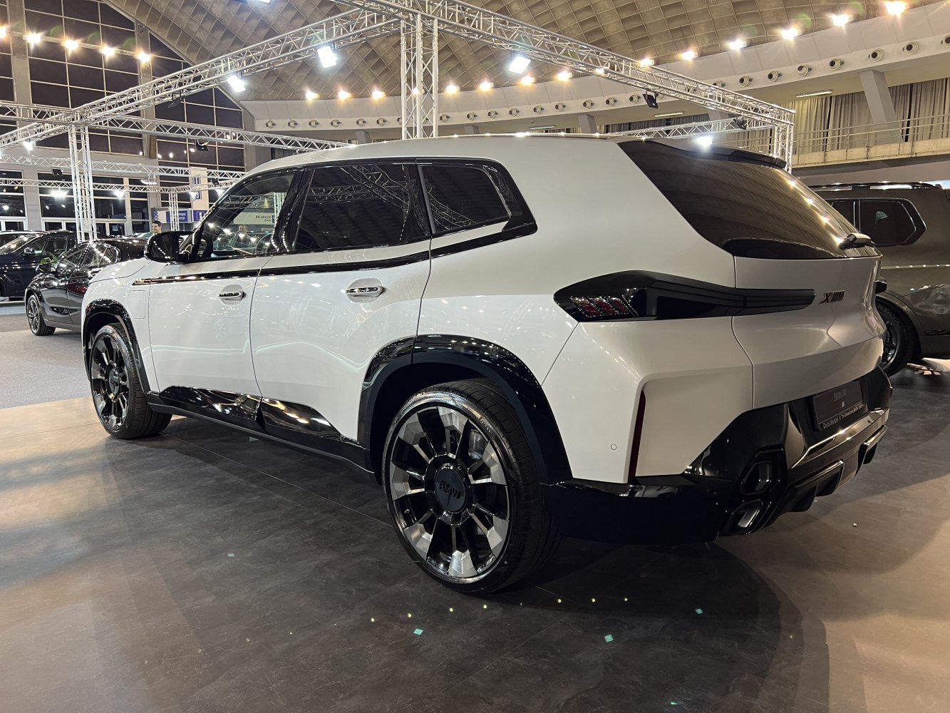 Rear side view with unique tail lights and large alloy wheels